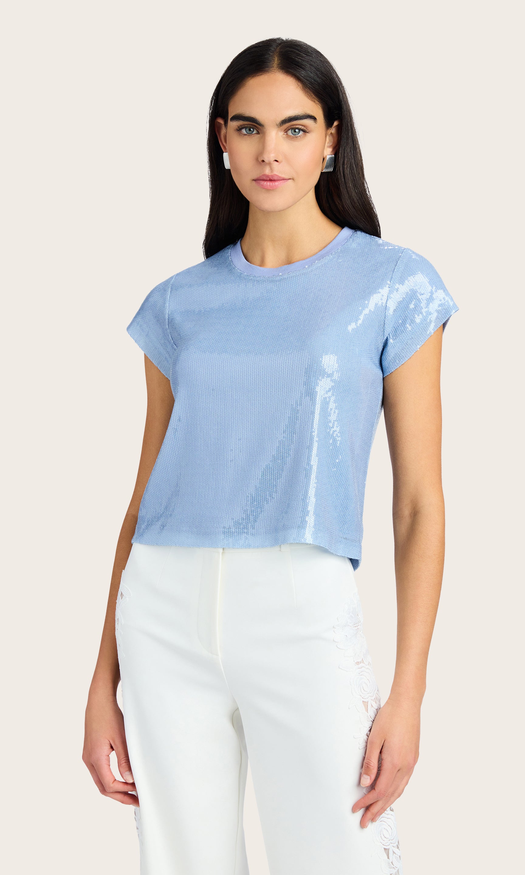 Front view of the Kai Sequin Top styled with white trousers for a casual polished look