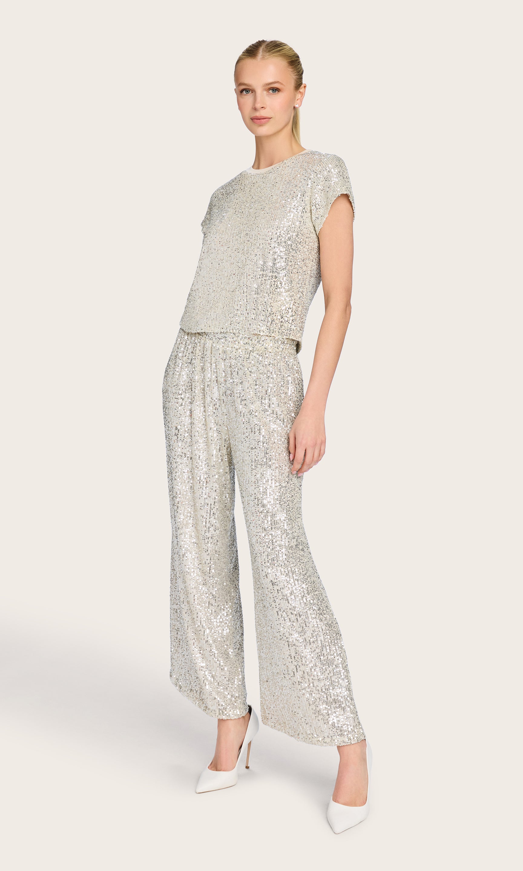 Full-body view of the model wearing the Kai Sequin Top and sequin pants, styled for a polished and glamorous set.