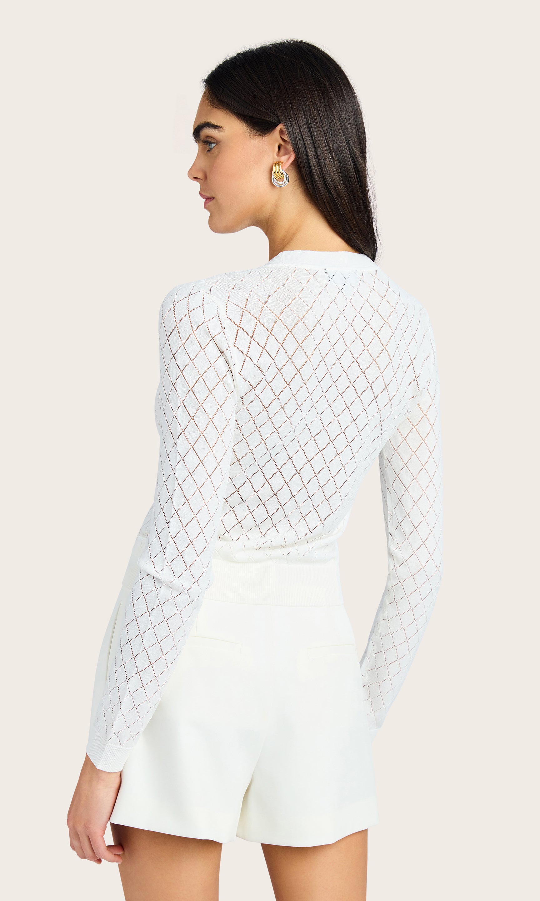 Rear view of the Leisha Cardigan showing the pointelle knit detail