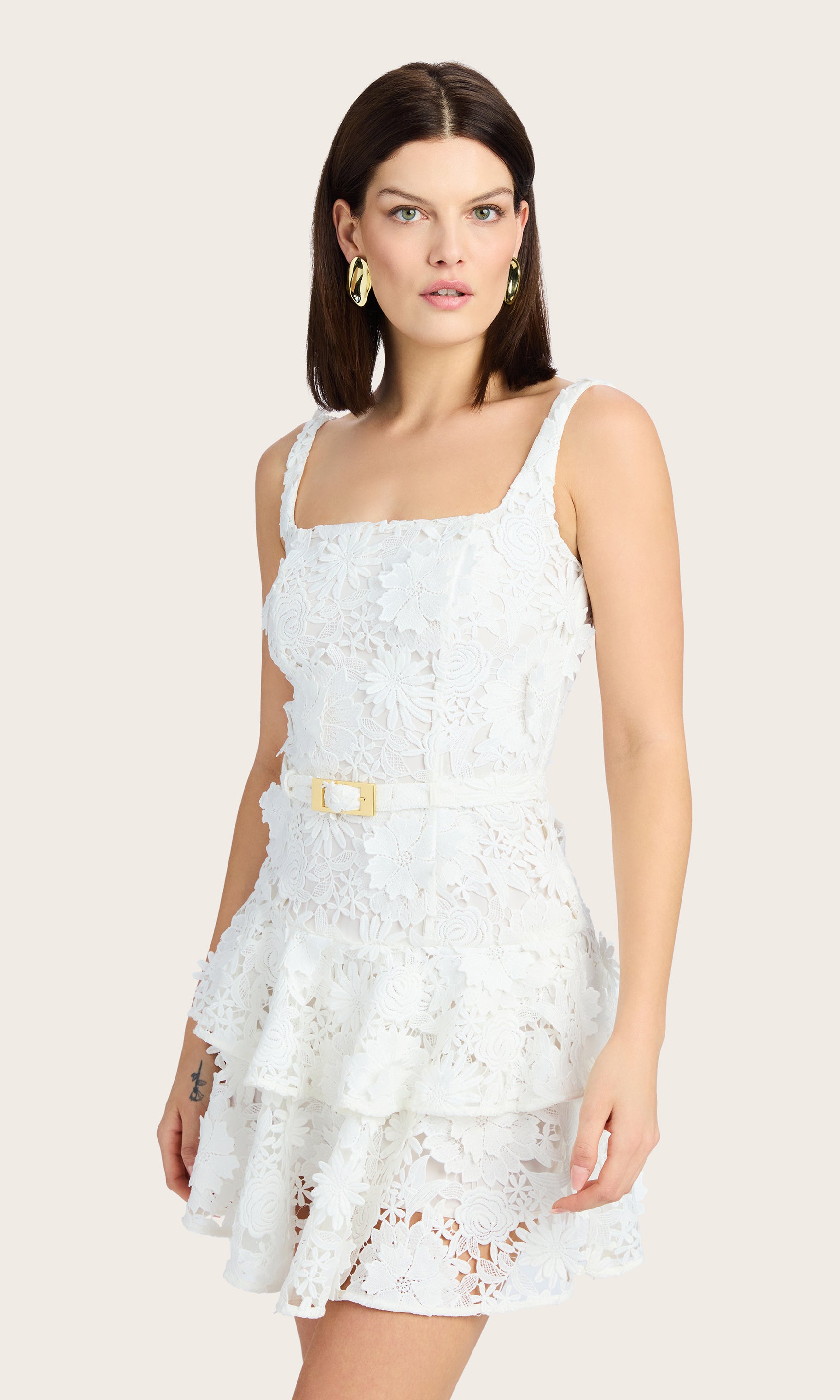 Side view of the Lisette 3D Lace Dress highlighting the slim fit and ruffle hem