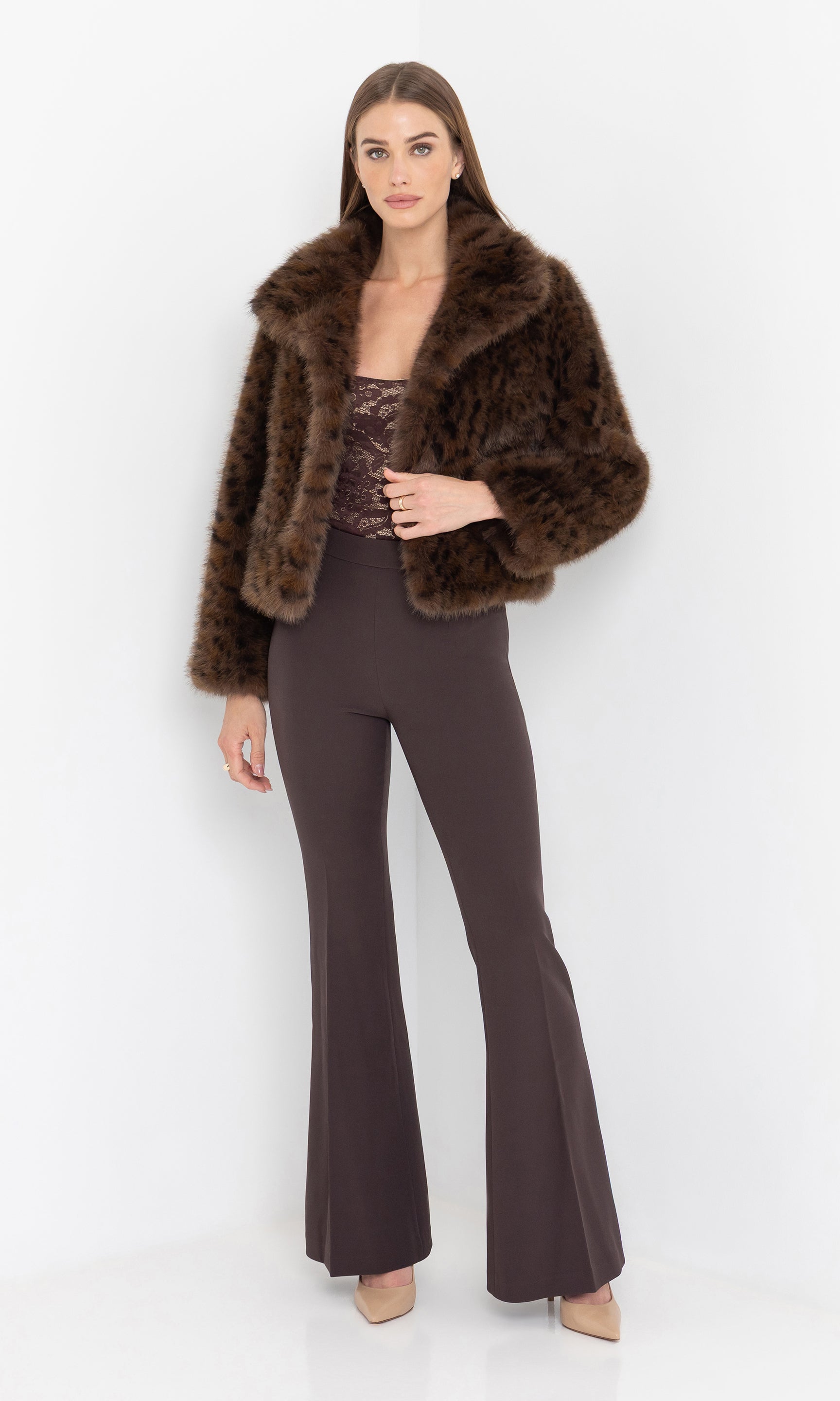 Full body front view styled with dark trousers.