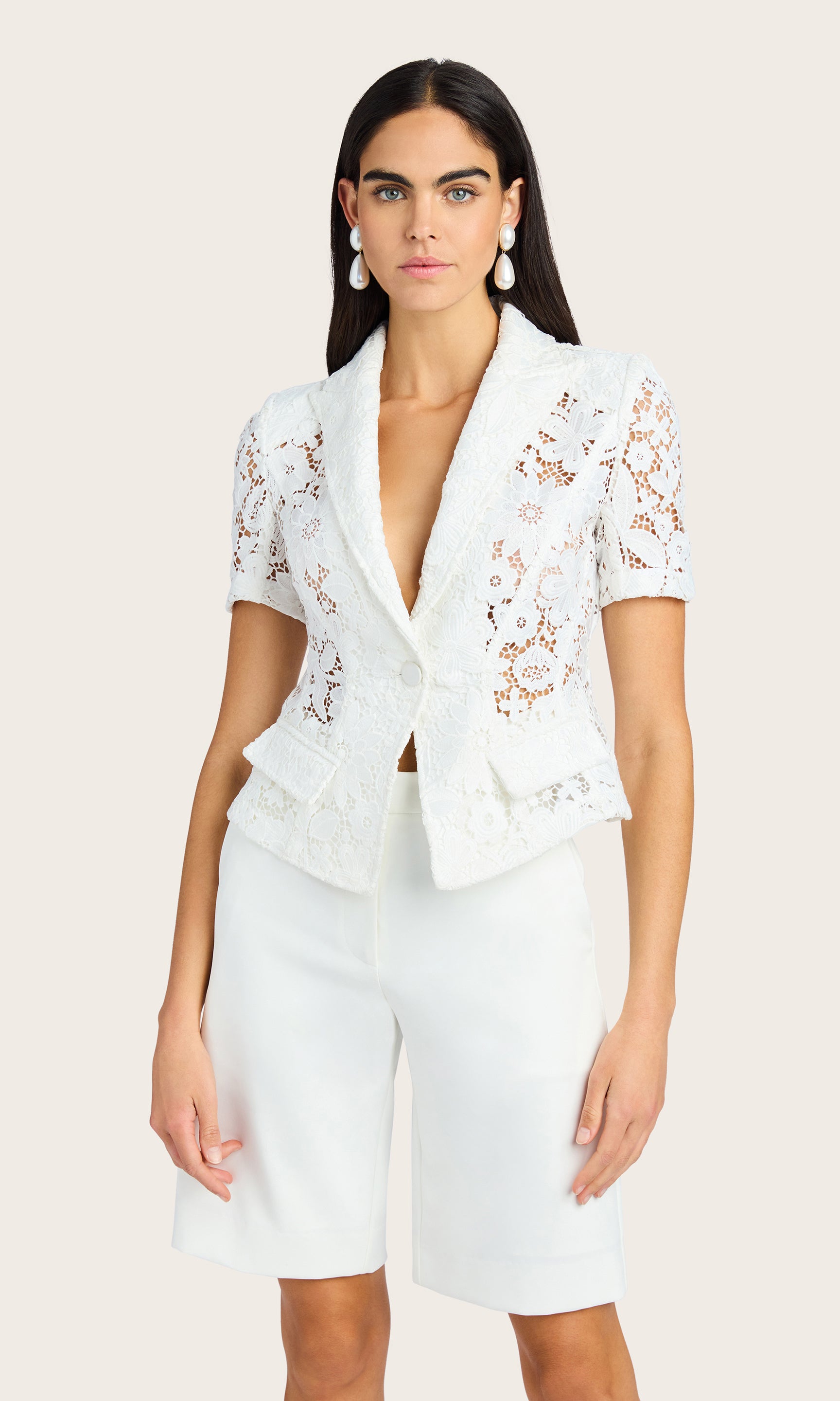 Front view of the Melbourne Lace Blazer styled with tailored white shorts