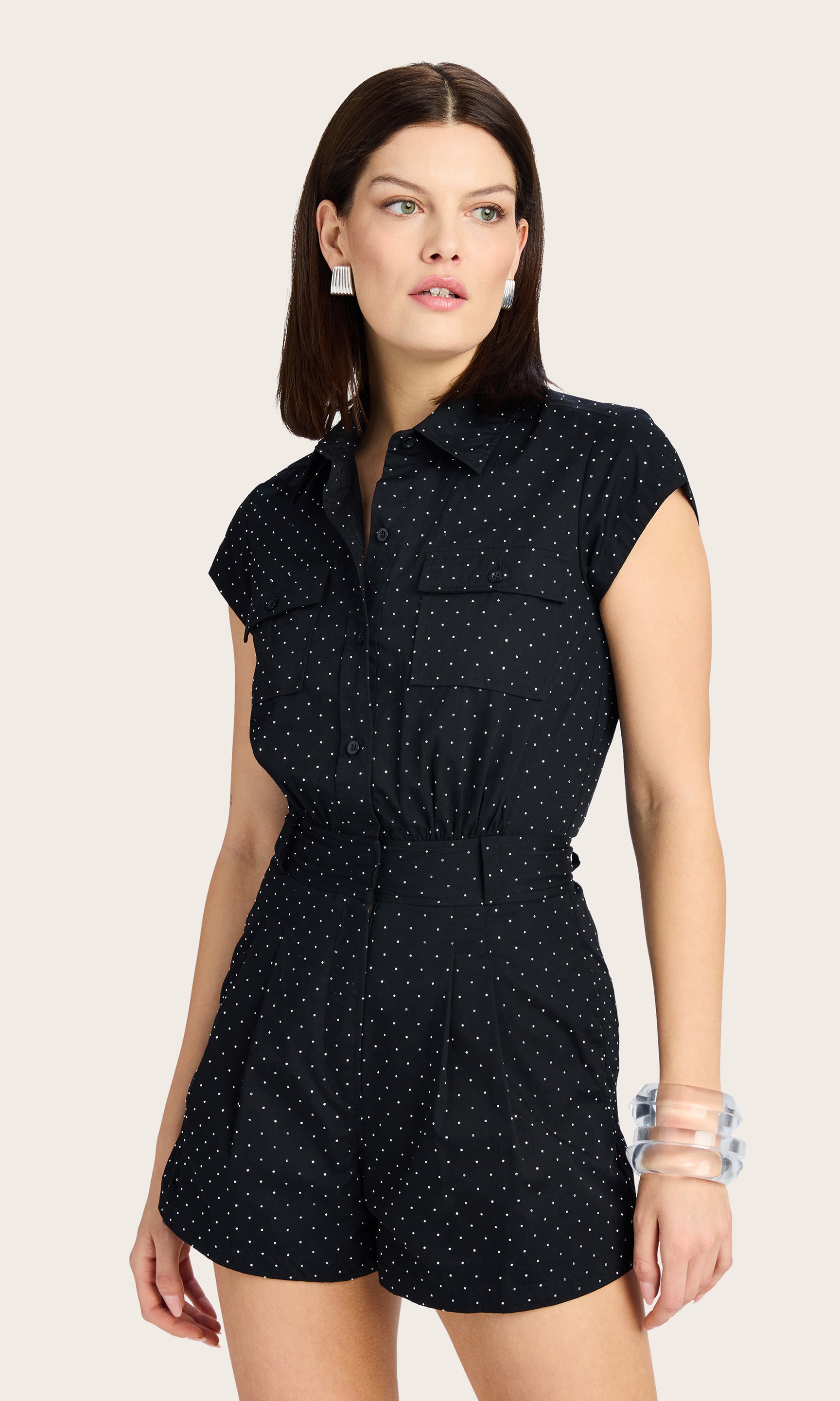 front view of the model wearing the Morgan Crystal Poplin Romper, showcasing the collared neckline, cap sleeves, and subtle allover crystal embellishments.