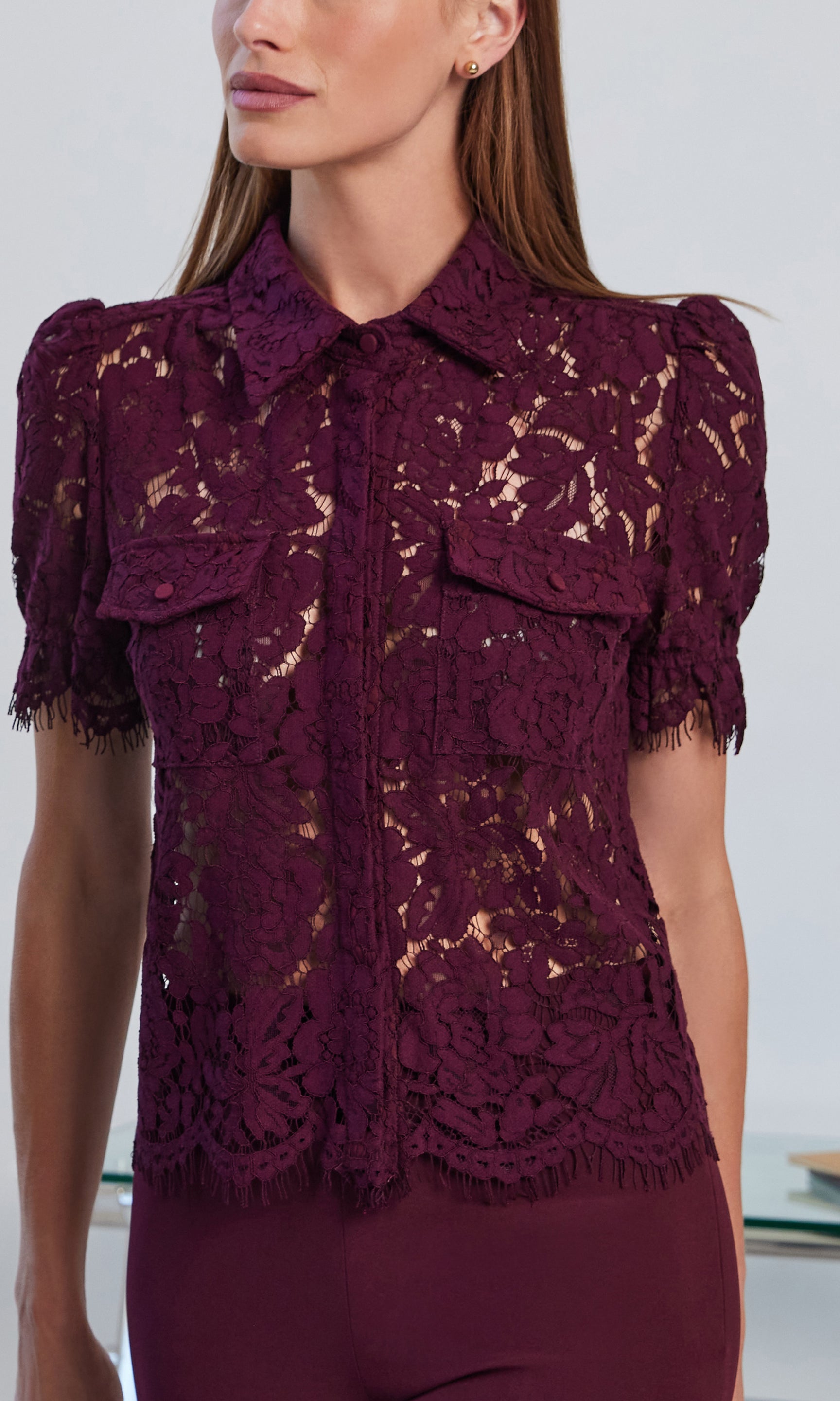 Close-up side view of the Mina Lace Shirt, highlighting the intricate lace pattern and structured collar.