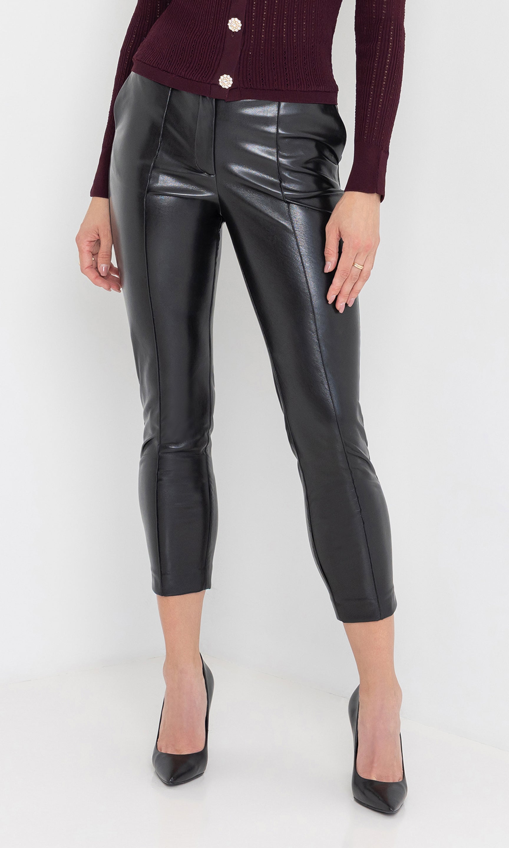 Front view of the tula vegan leather pants showing the sleek ankle length.
