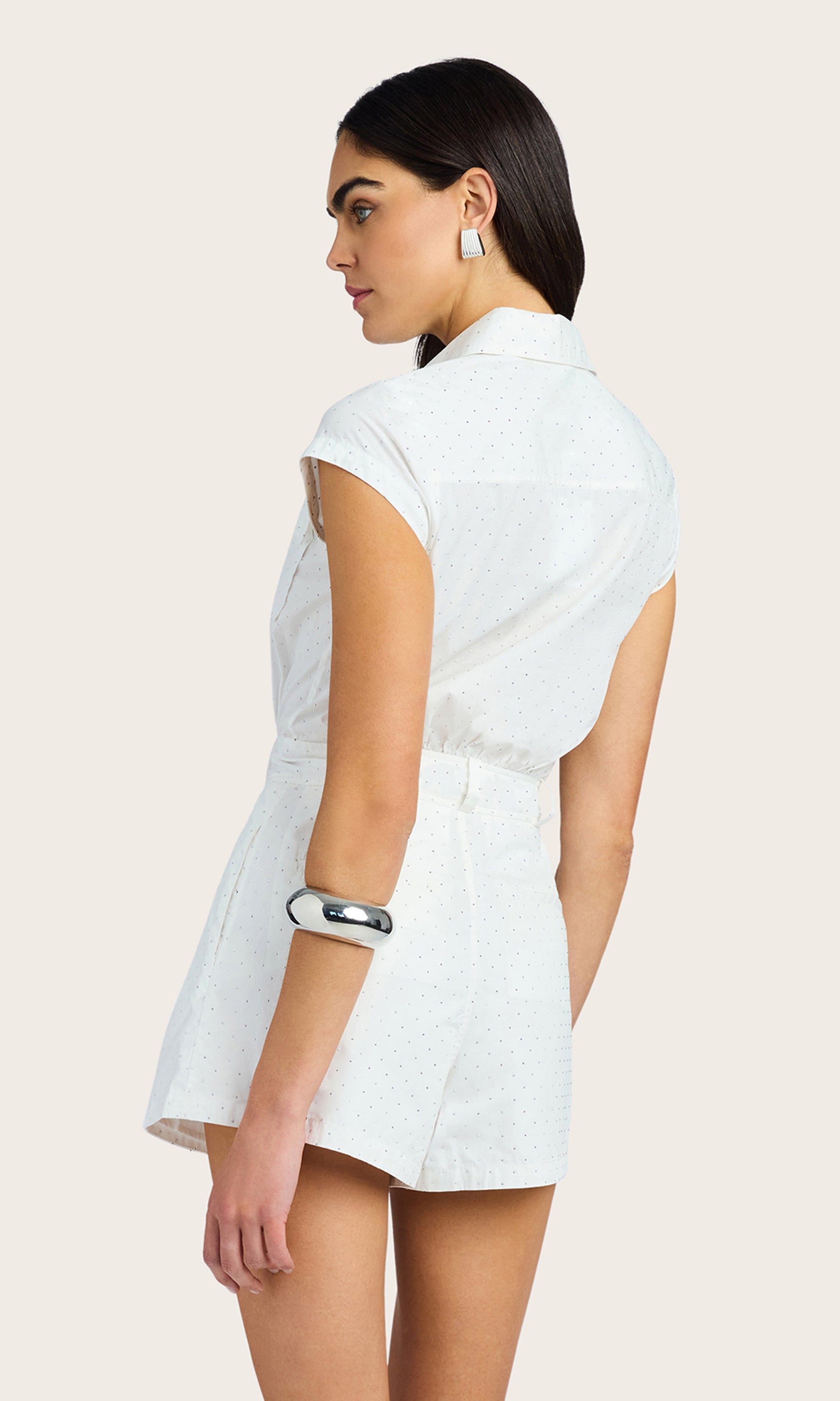Rear view of the Morgan Crystal Poplin Romper in white, showing the back pleats and tailored structure.