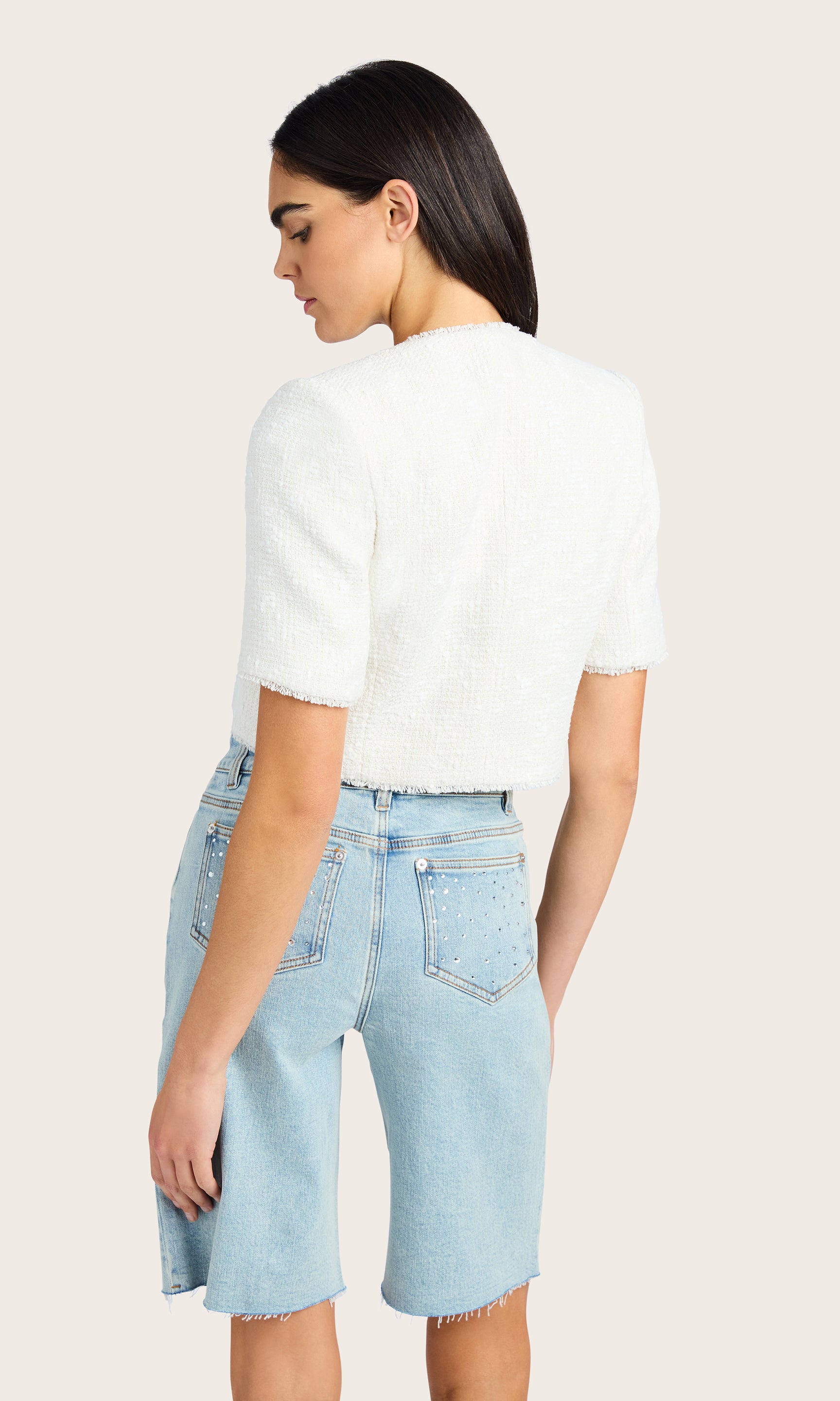 Rear view of the Nikki Tweed Jacket. Displays the back fit and the full look of the shorts.