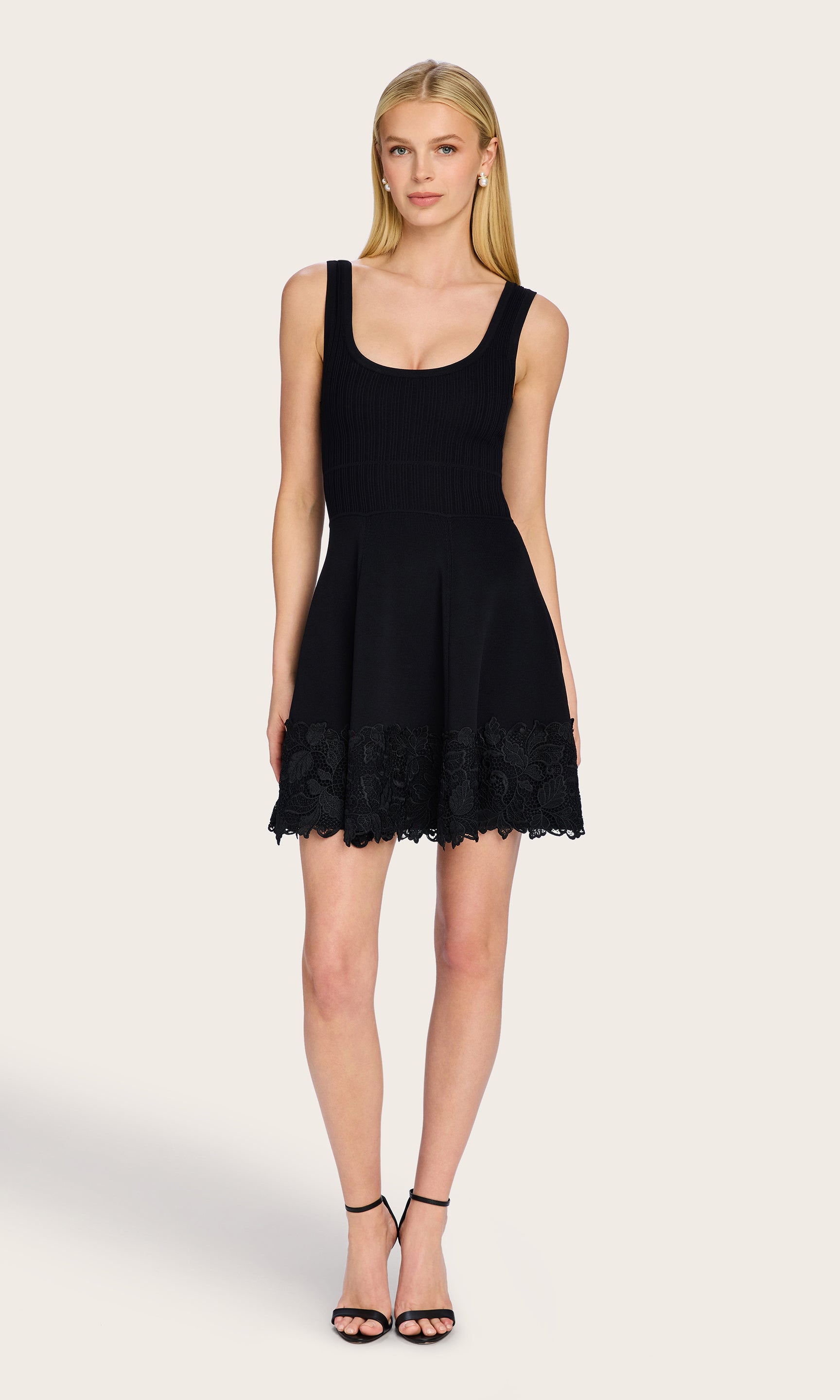 Full body image of the model in the Orpheus Lace Combo Rib Dress, styled simply to showcase the flirty, flattering shape.