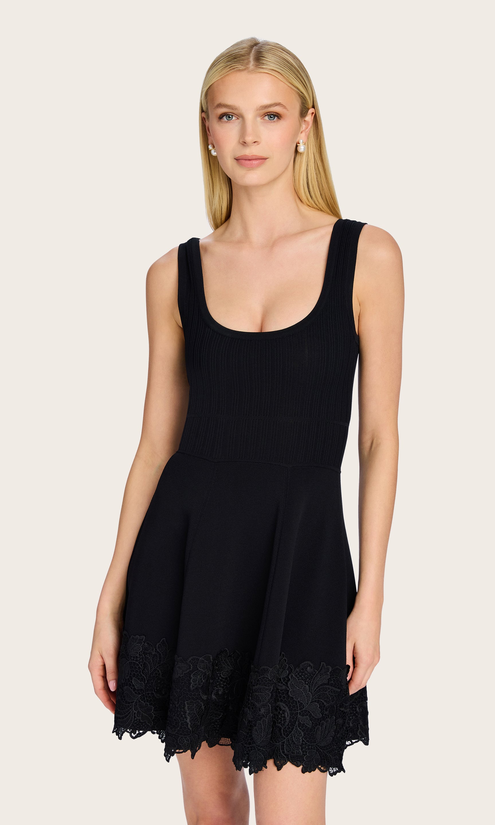 Front-facing shot of the model wearing the Orpheus Lace Combo Rib Dress, drawing attention to the clean structure and classic cut.