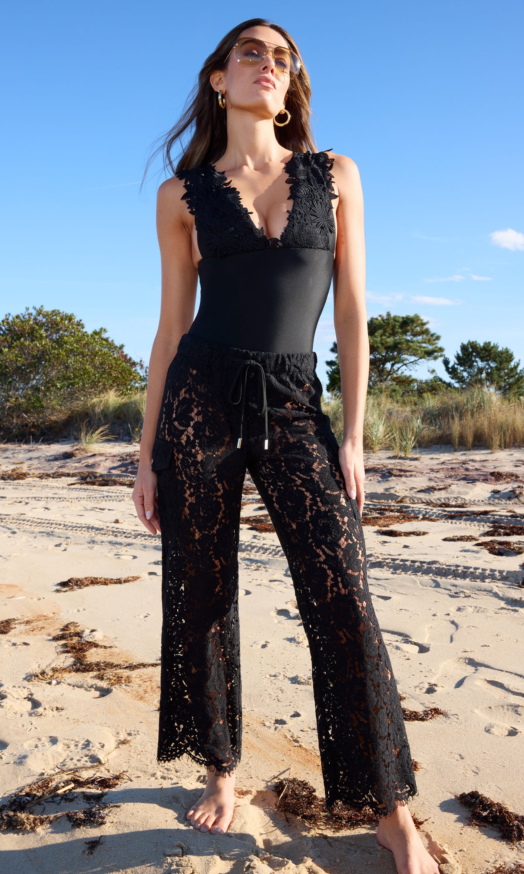 Palmer Lace Cargo Pant in black lace, showcasing a fashionable and eye-catching style for any outfit.