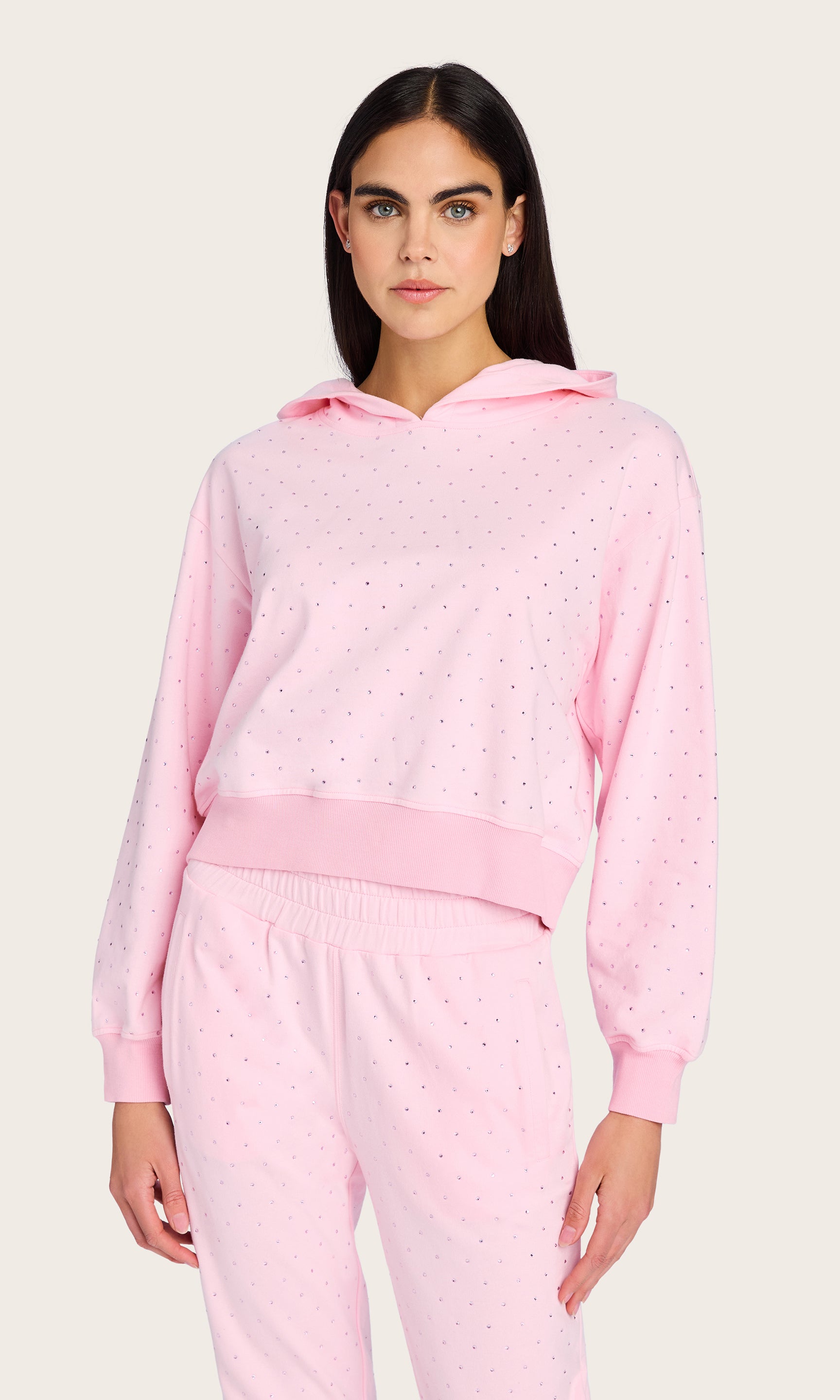 Front view of the model wearing the Renae Crystal Hoodie with matching sweatpants, styled for a chic off-duty look