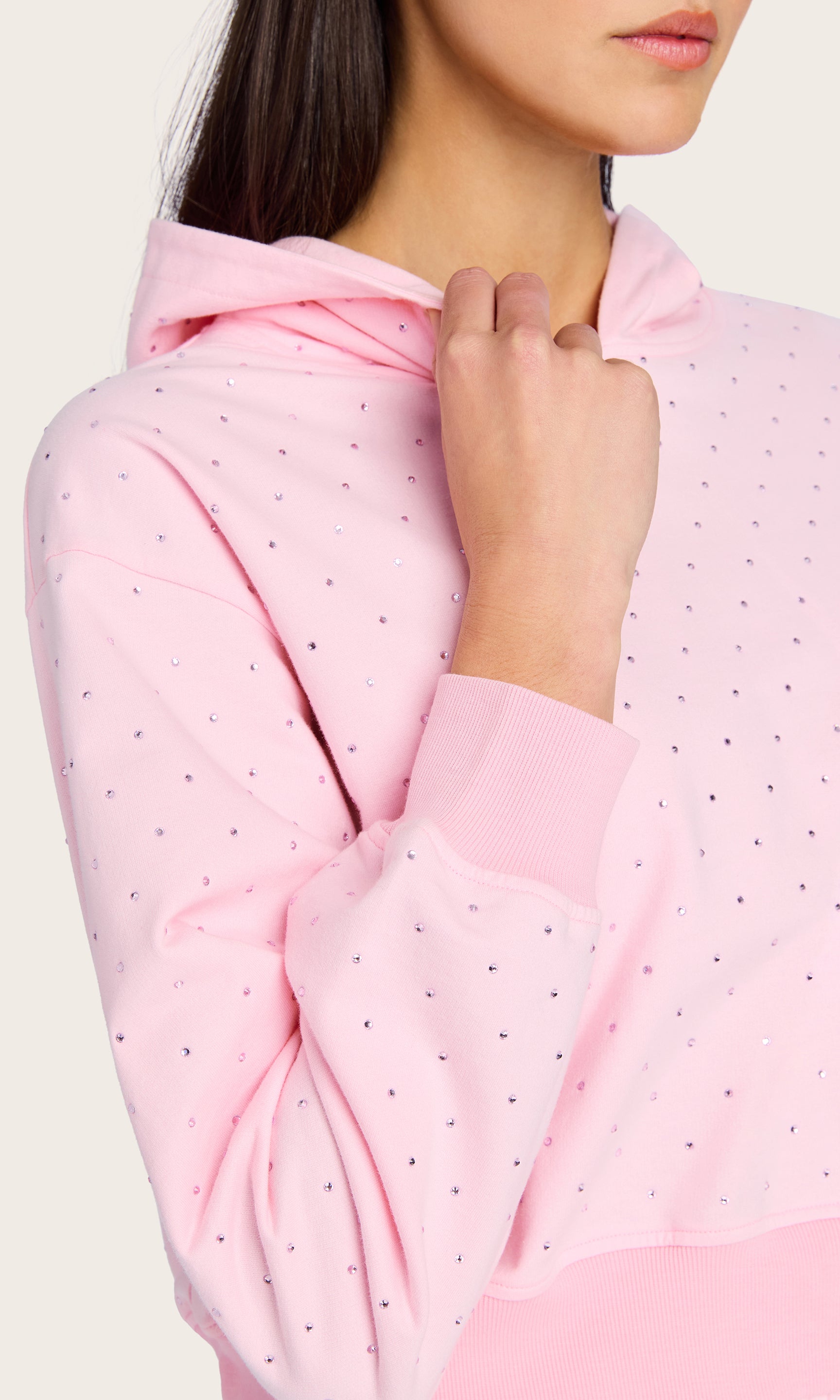 Close-up view of the Renae Crystal Hoodie highlighting the delicate crystal embellishments and ribbed cuff detail near the neckline