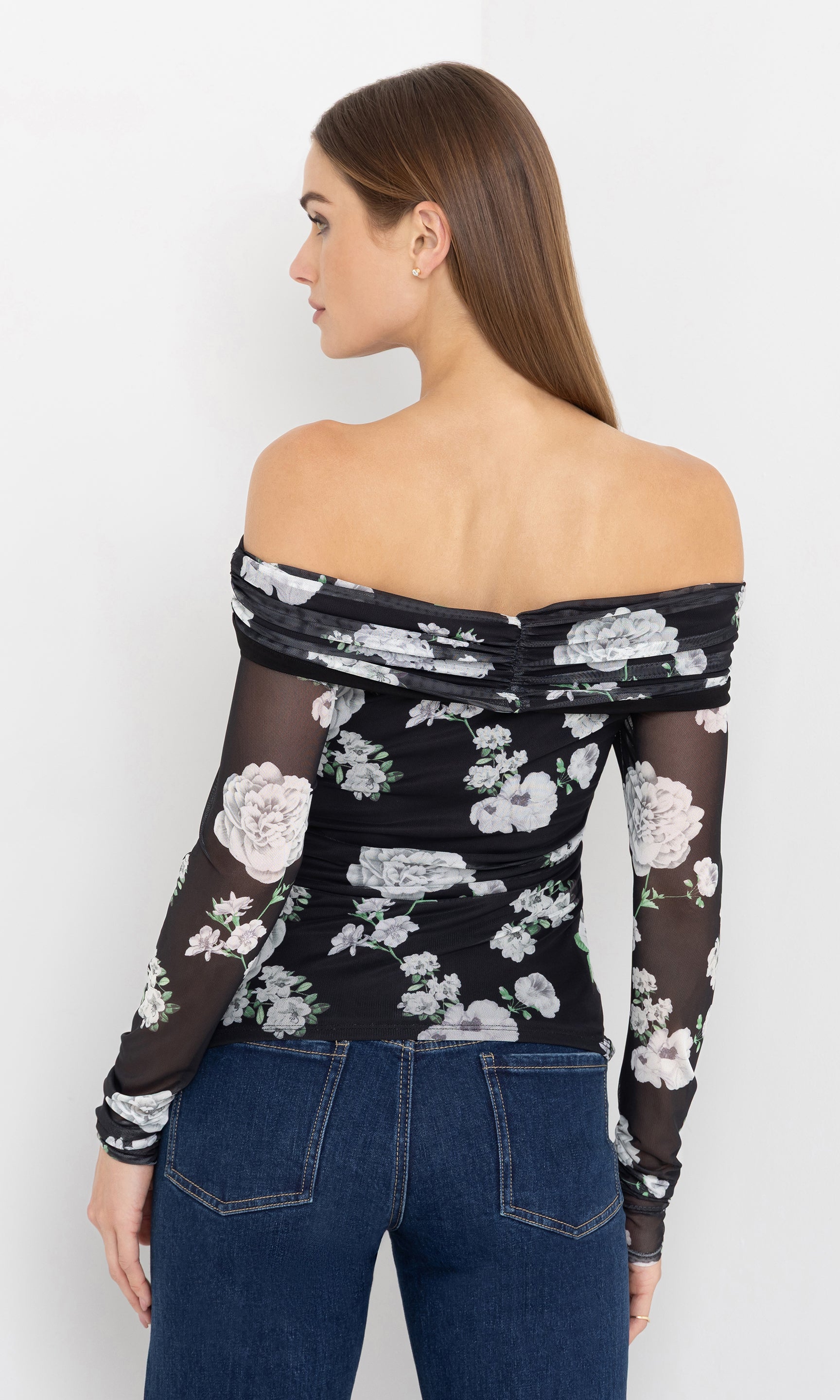 Back view of the romeo floral mesh top showing the sheer sleeves.
