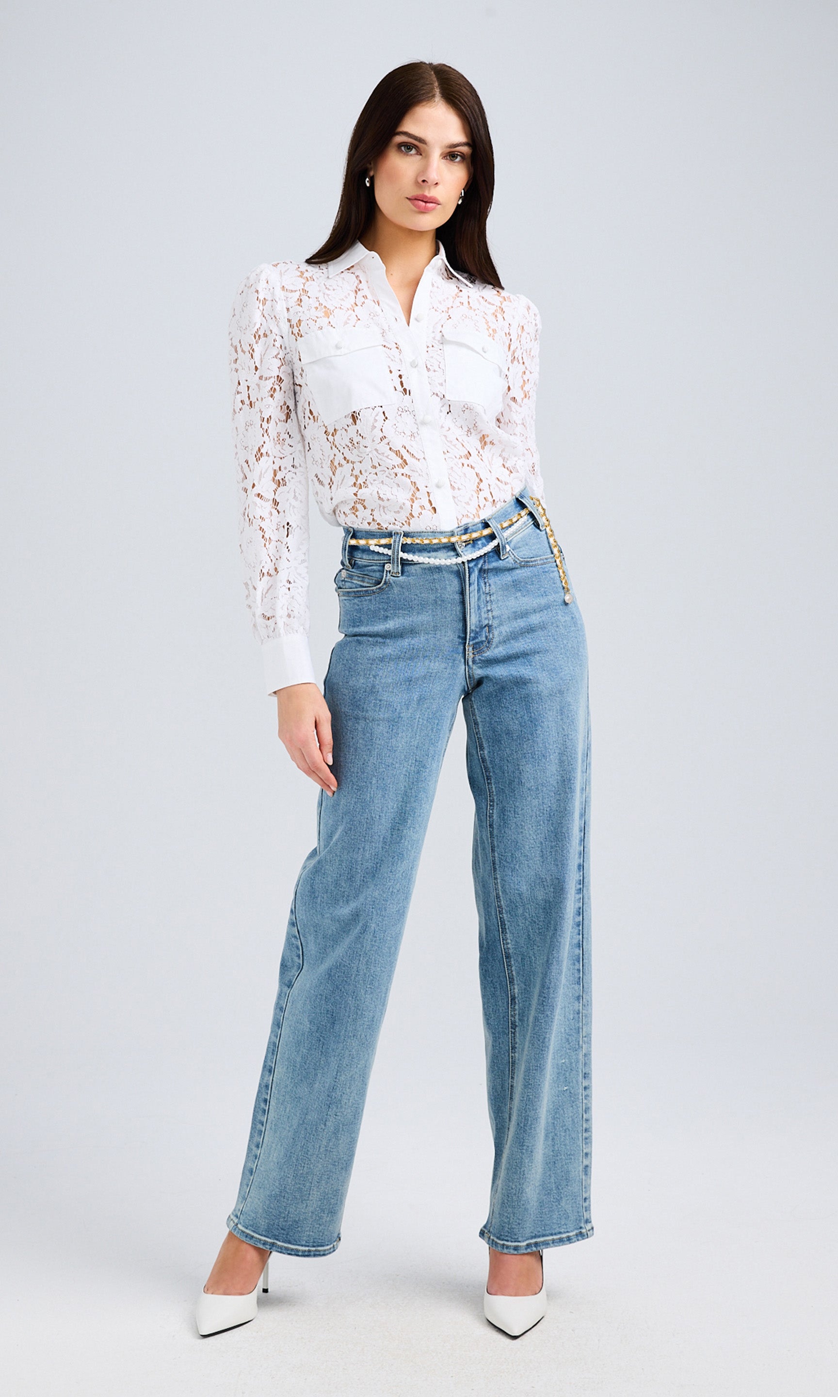 Full-body view of the model wearing the lace poplin combo shirt styled with wide-leg jeans.