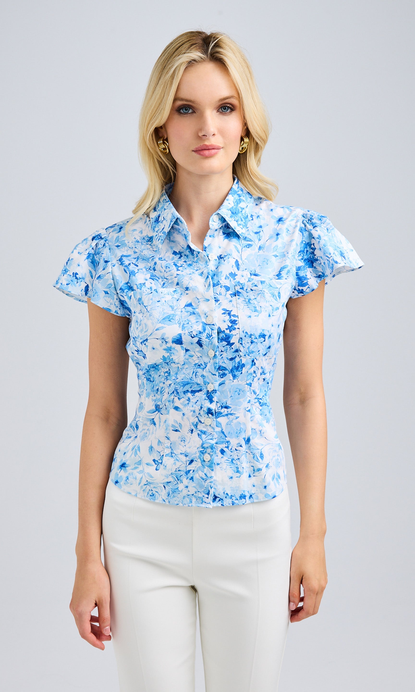 Front view image capturing the button-up closure and contoured fit of the blouse.