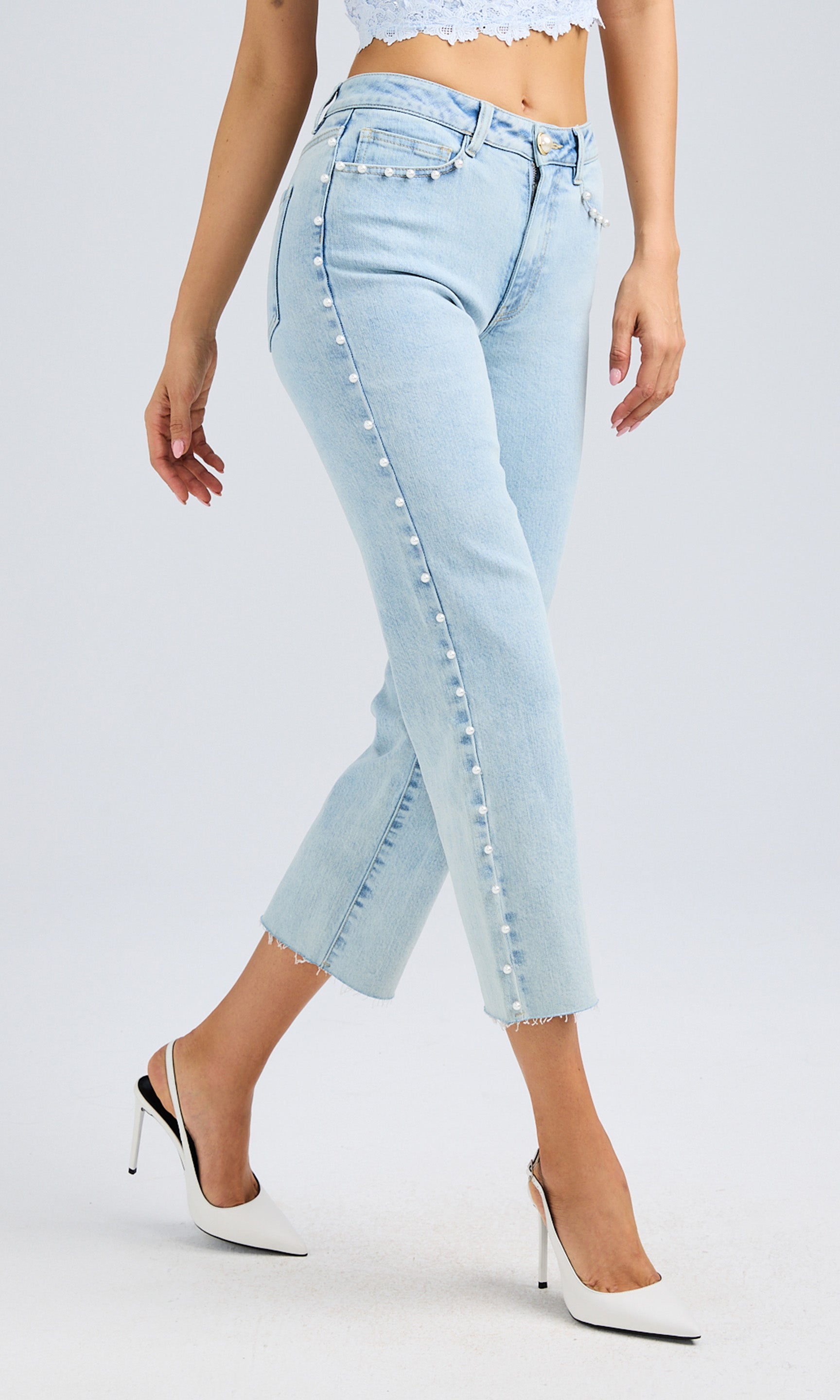Side view of the jeans, highlighting the relaxed fit and cropped length.