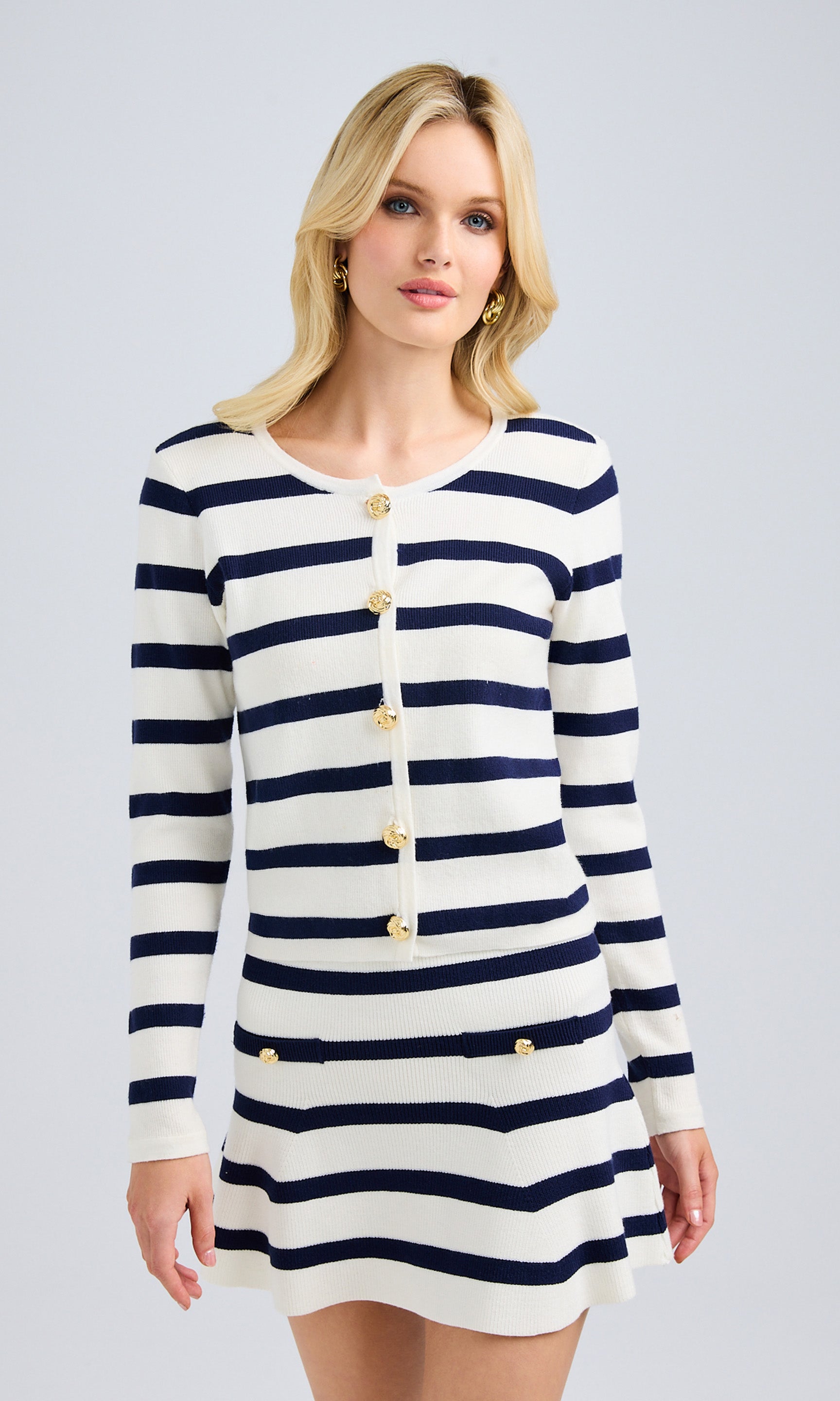 Front view of the striped knit cardigan, showcasing its relaxed fit and button details.
