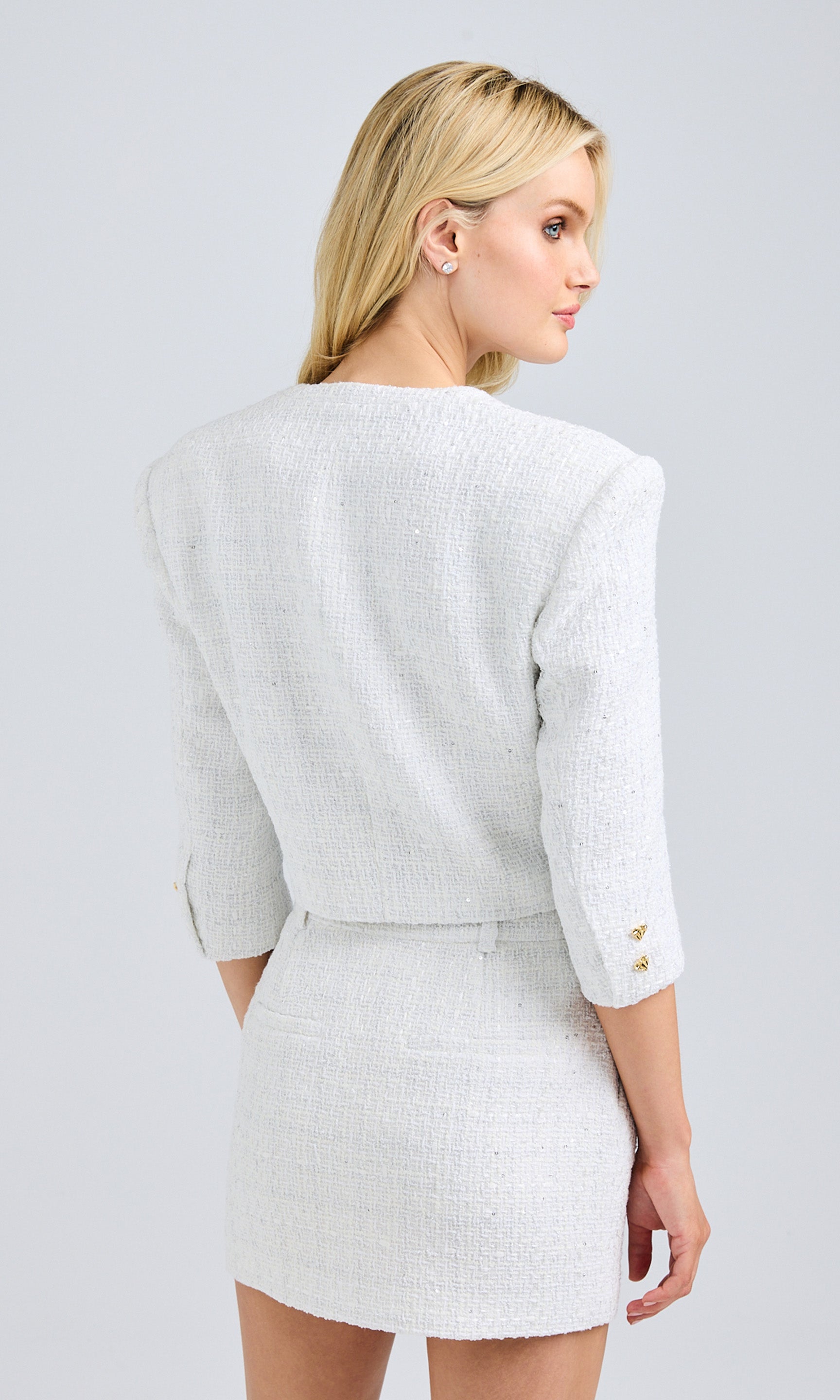 Full-body view displaying the entire outfit, emphasizing how the shorts are styled for a chic, put-together look.