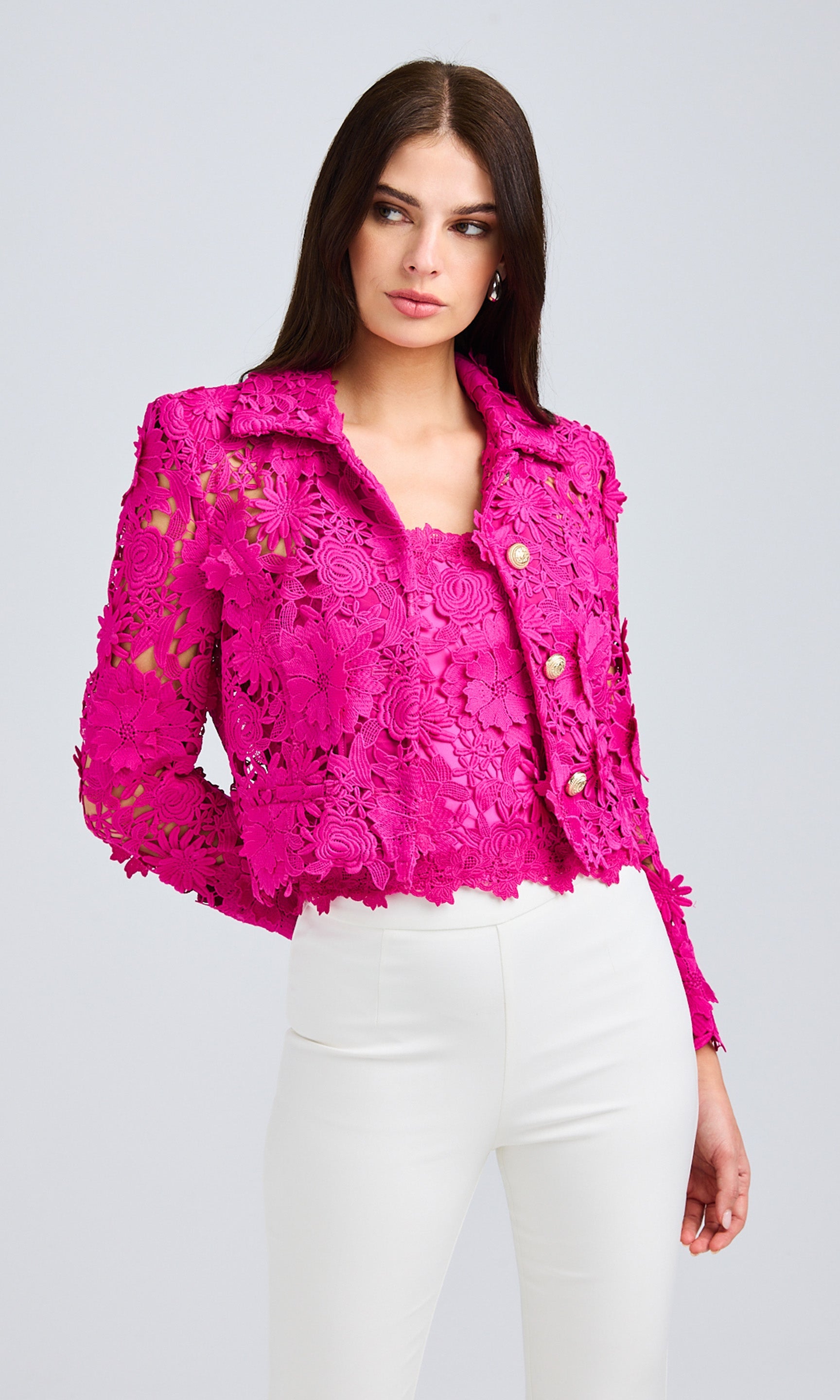 Front view of the model in the lace jacket, showcasing its intricate texture and structured fit.