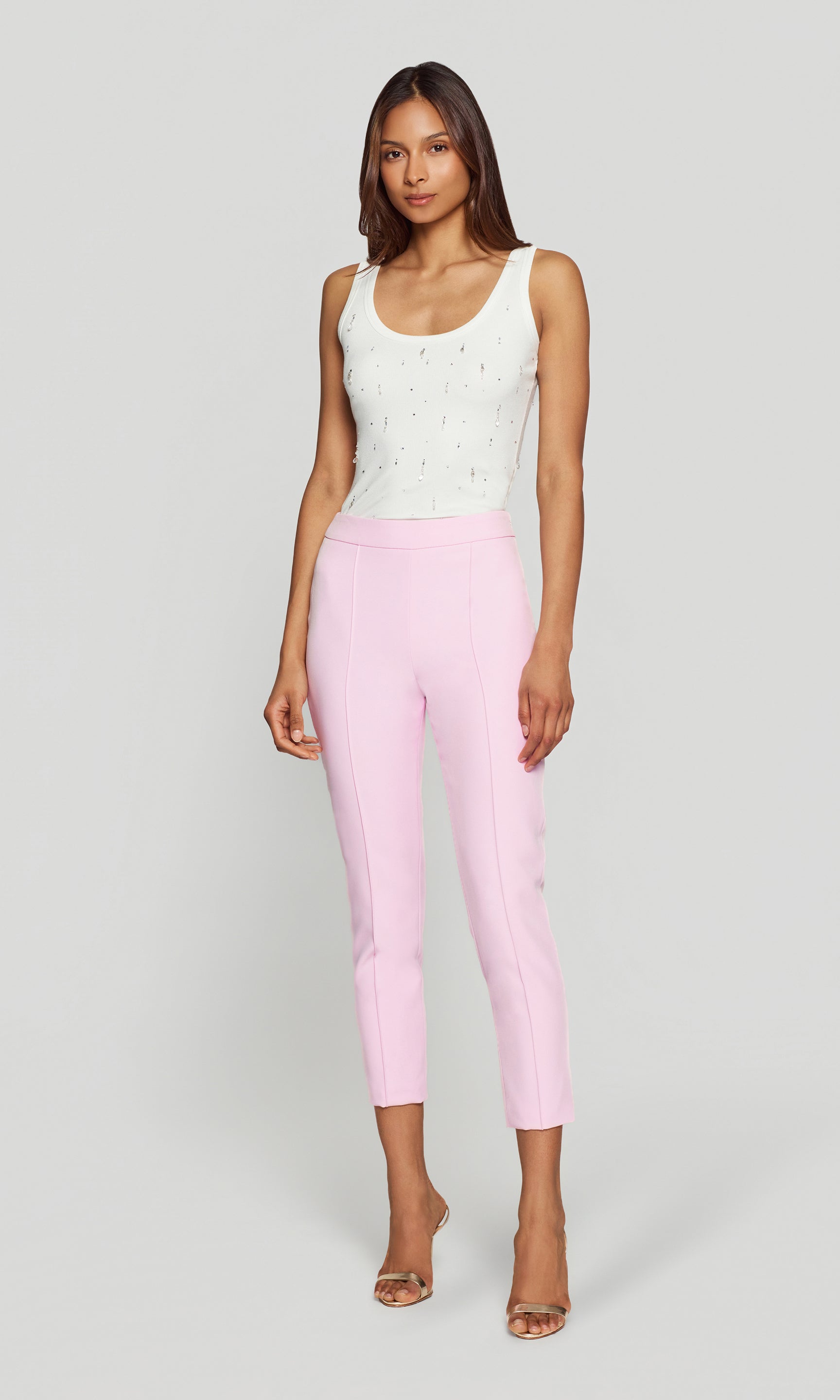 Model wears the Lonny Crepe Pants in soft rose in a full body front view on a neutral background, styled with heels to show the flattering high waist and streamlined fit.