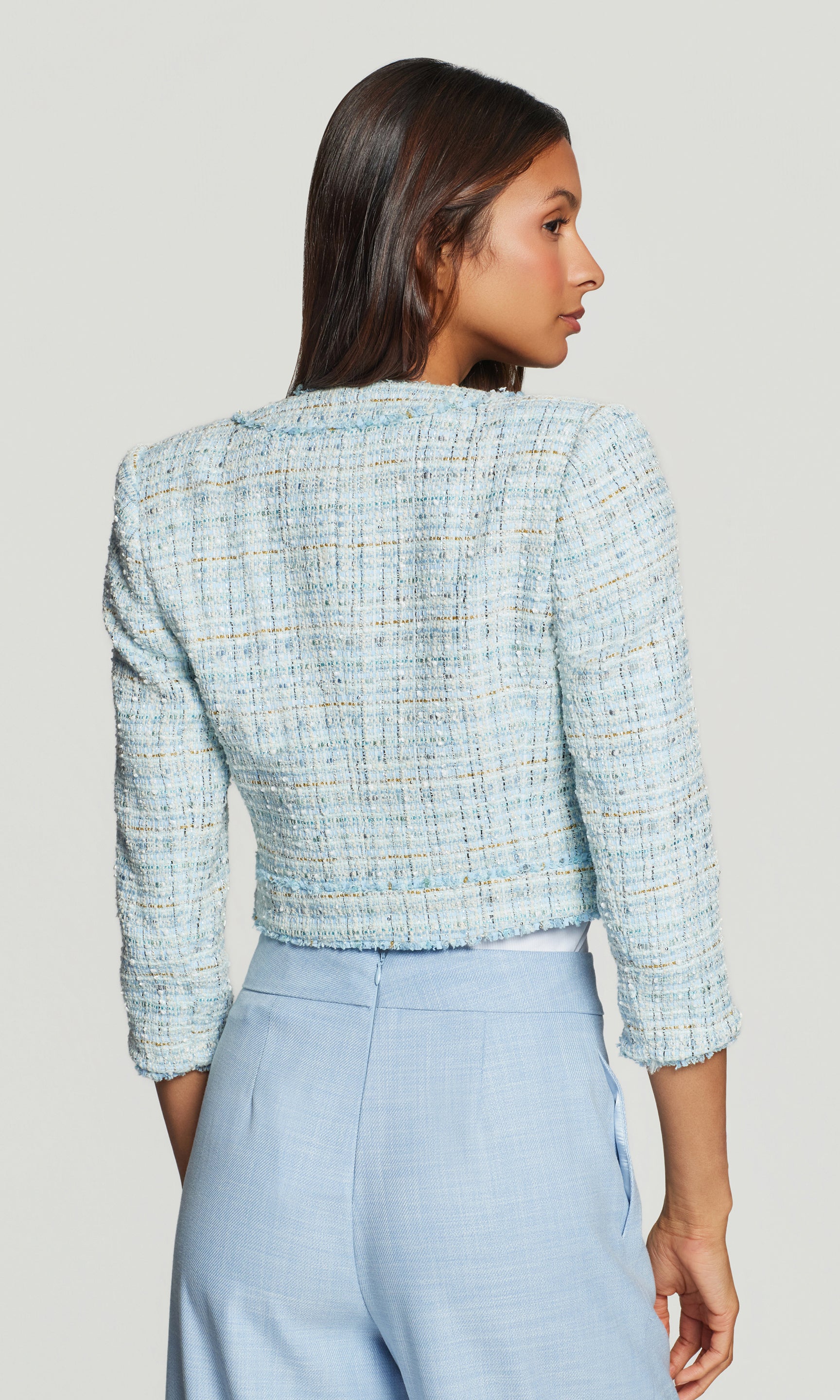 Model wears the Salvador Tweed Blazer in aqua melange in a back view, showing the cropped length and structured fit.