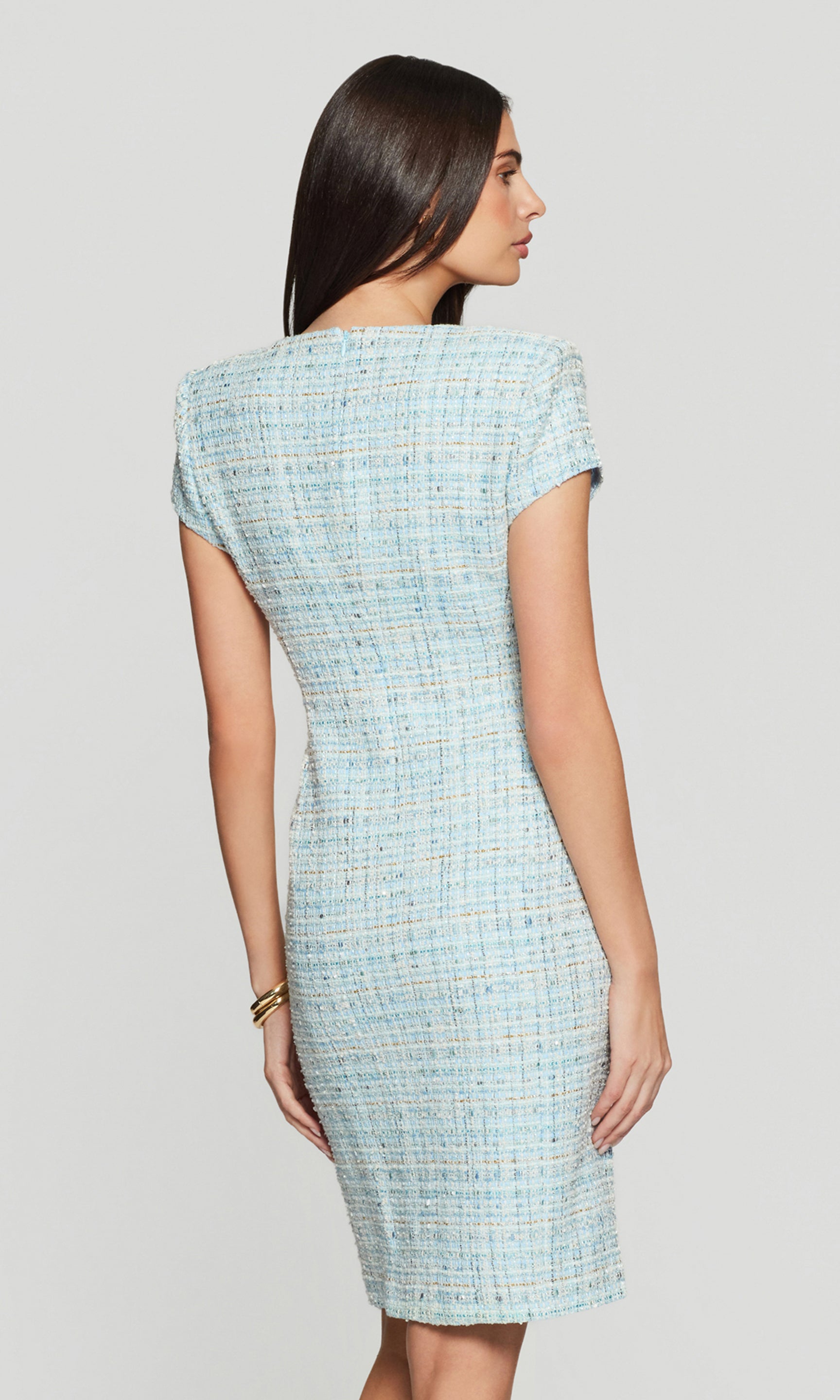 Model wears the Sierra Tweed Dress in aqua melange in a full-body back view, showing the cap sleeves and tailored fit through the waist and hips.