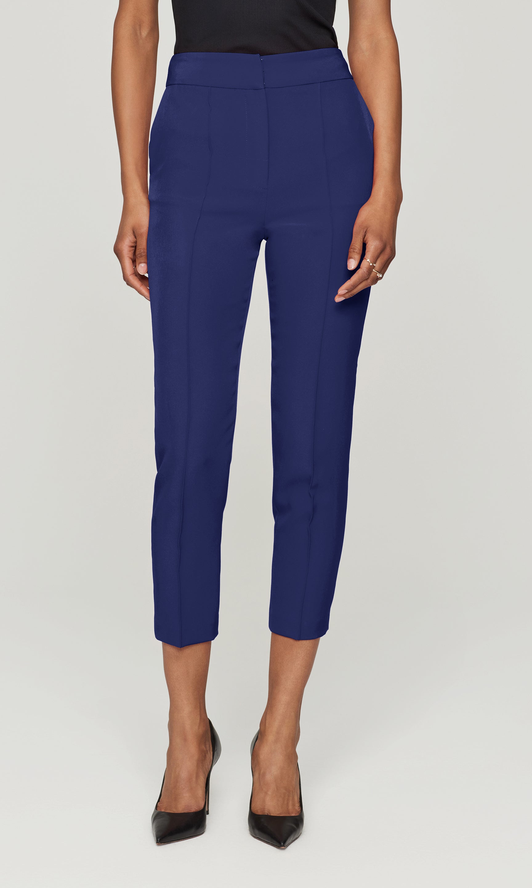 Person wearing blue pants on a white background