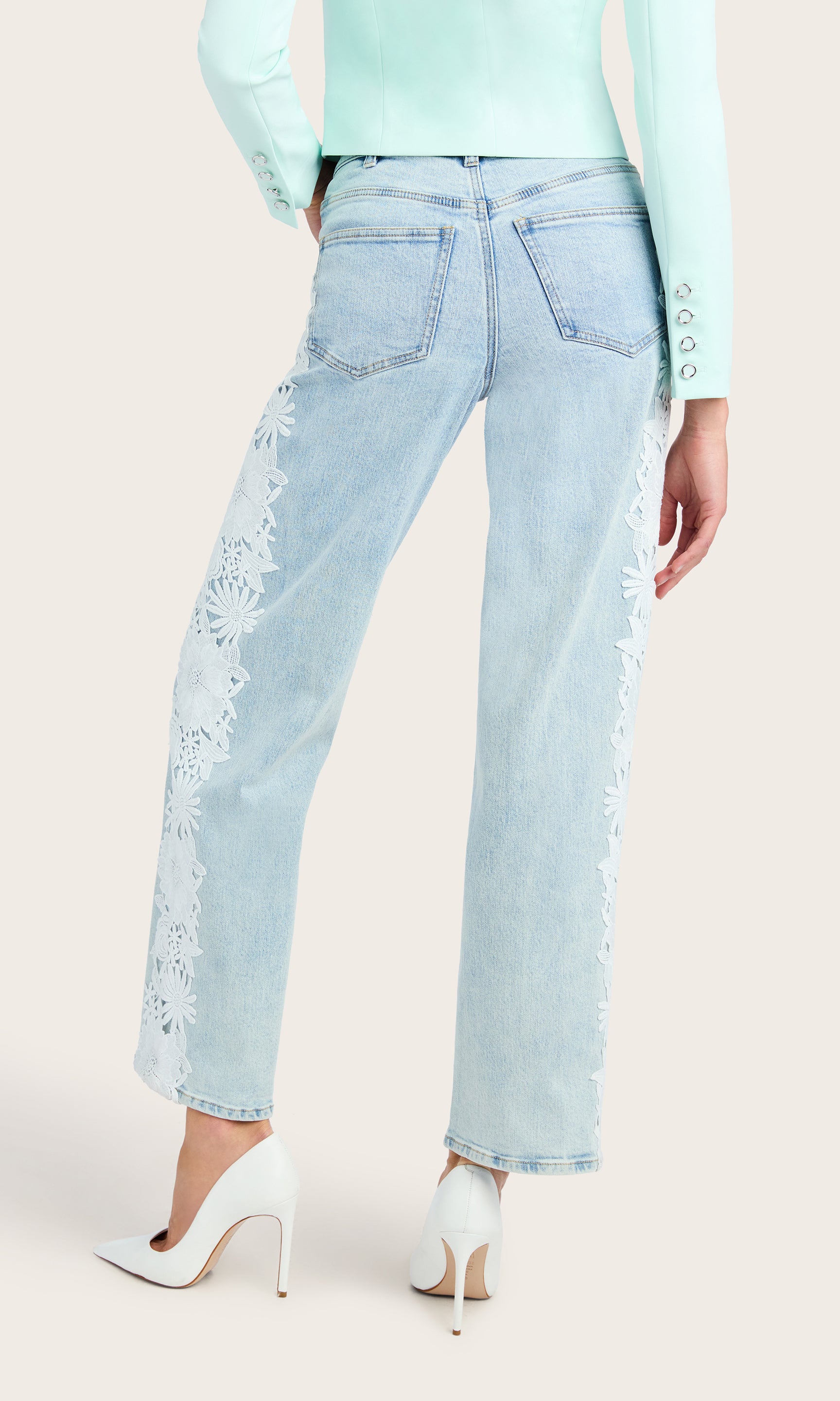 Back view of the Jethro Lace Combo Denim Jeans paired with a matching crepe blazer