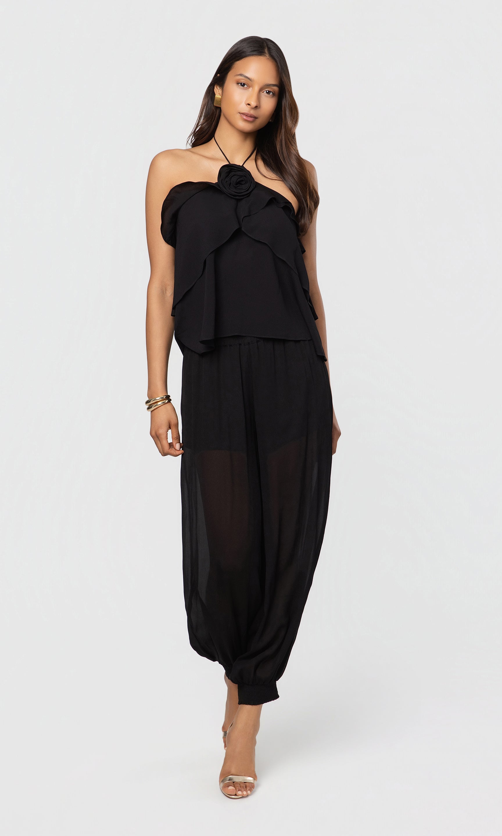 Woman wearing a black outfit on a white background