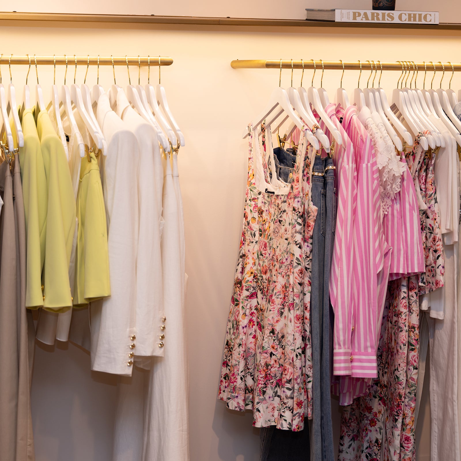 image of Gen Love summer styles on a rack that show a variety of crepe styles, florals and pink stripes