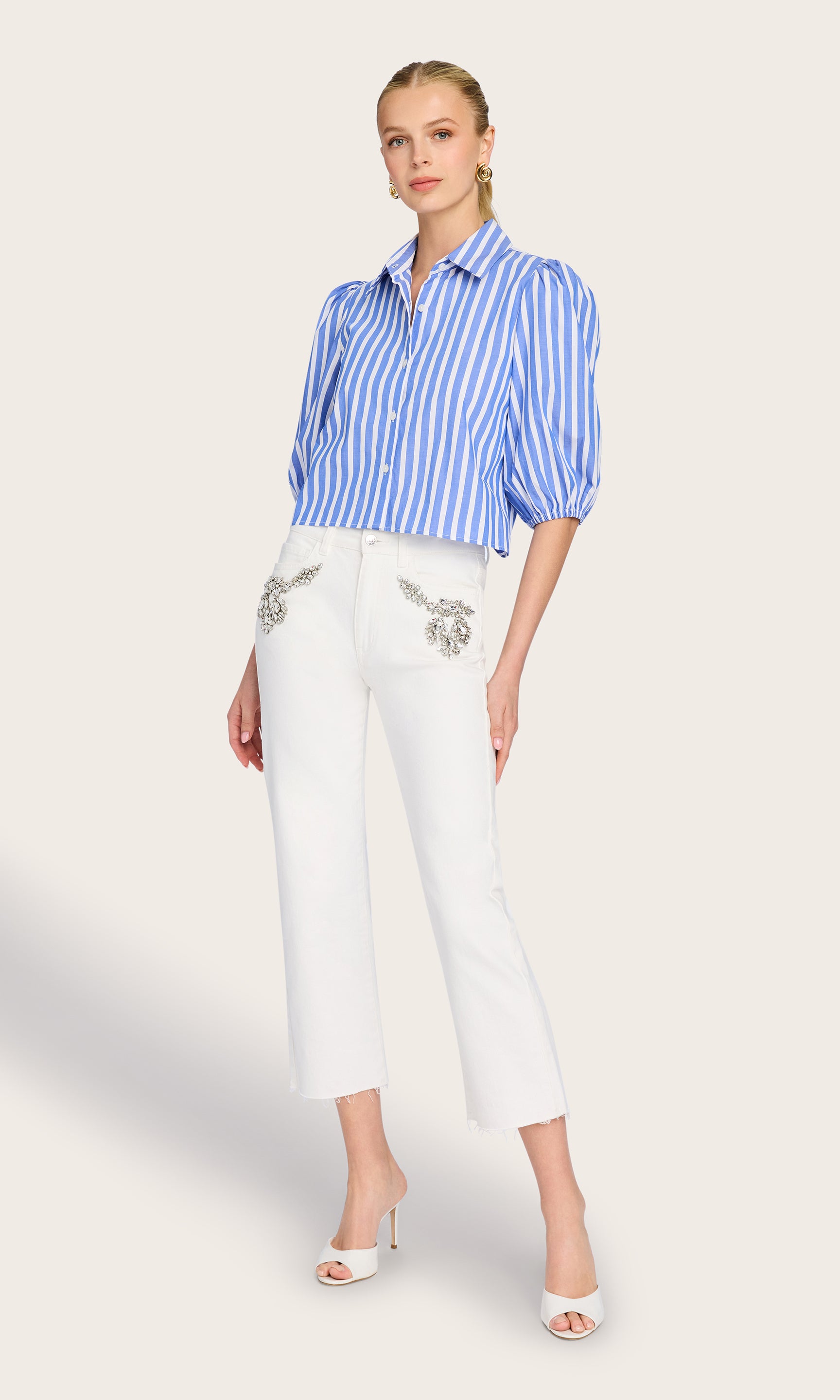 Full body front view of the model wearing the Tammy Wide Stripe Shirt, showcasing its cropped fit and vibrant stripes.