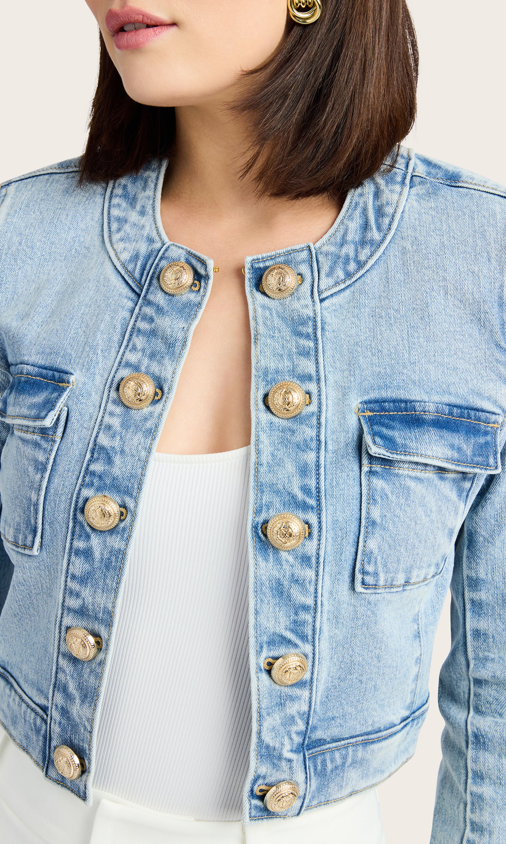 Close-up view of the Valentina Denim Jacket highlighting the cropped fit and button detailing.