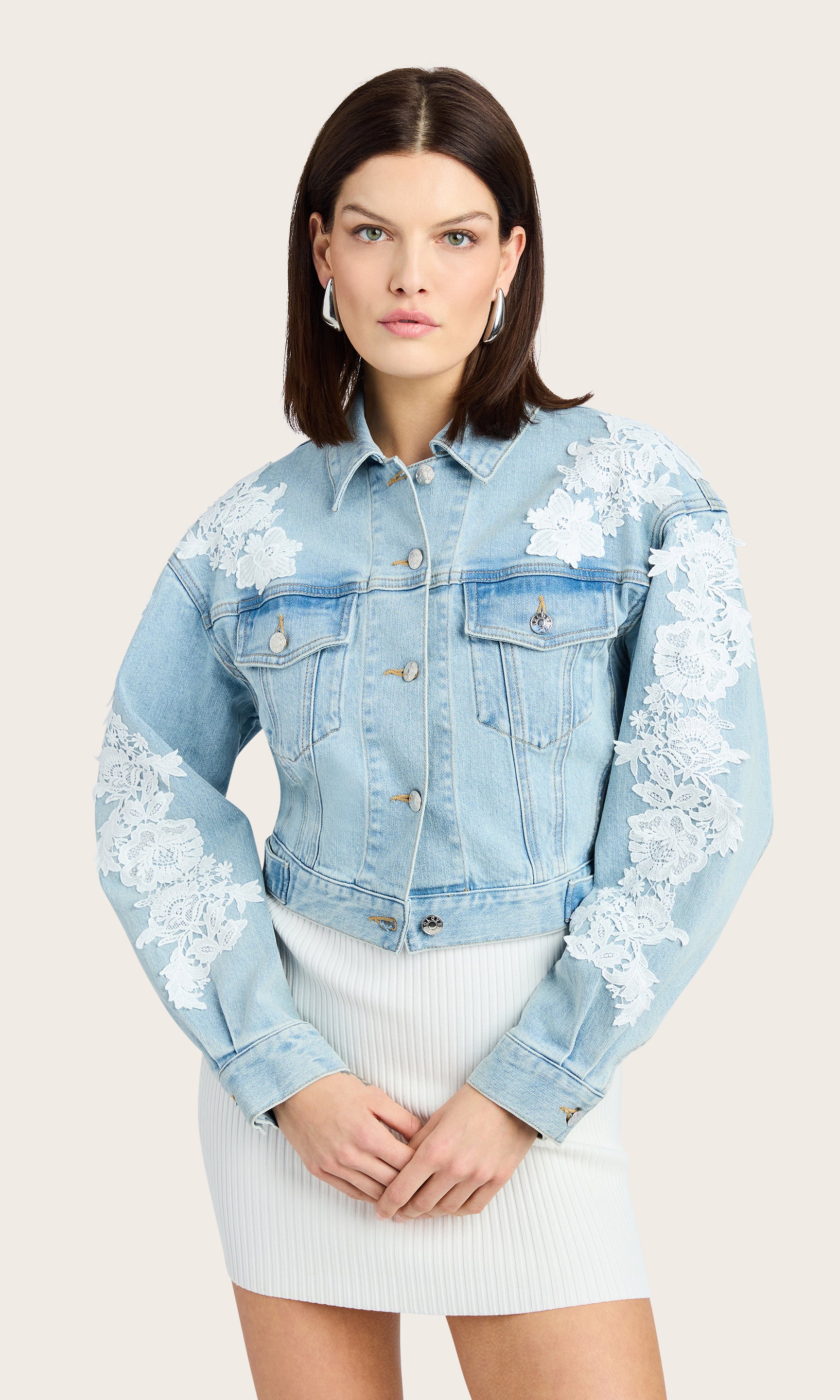 Front view of the Valex Lace Combo Denim Jacket styled with a white dress