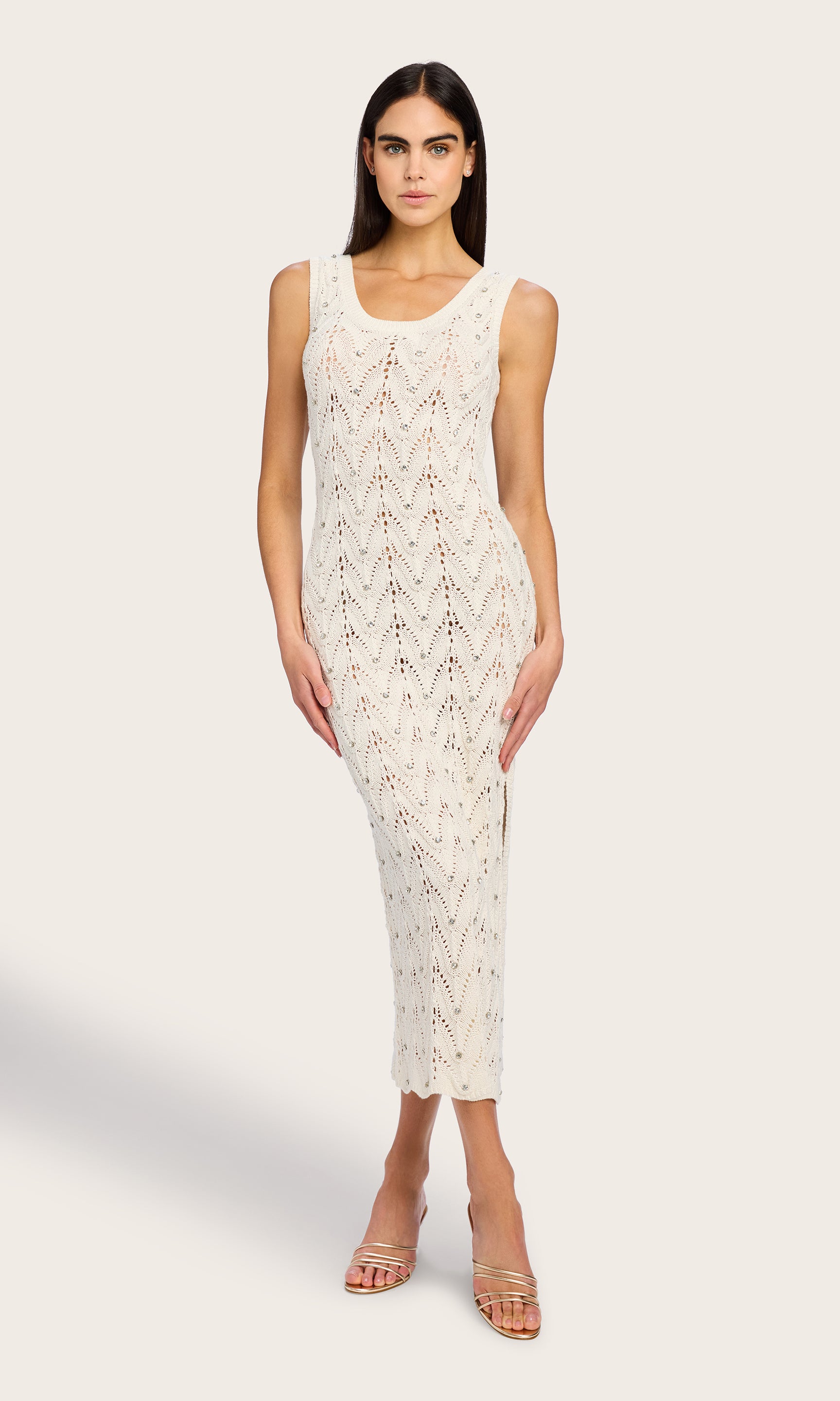 Full body front view of the Vincent Crystal Pointelle Knit Dress styled on the model, showcasing the dress’s figure-skimming fit and summery elegance in a relaxed stance.