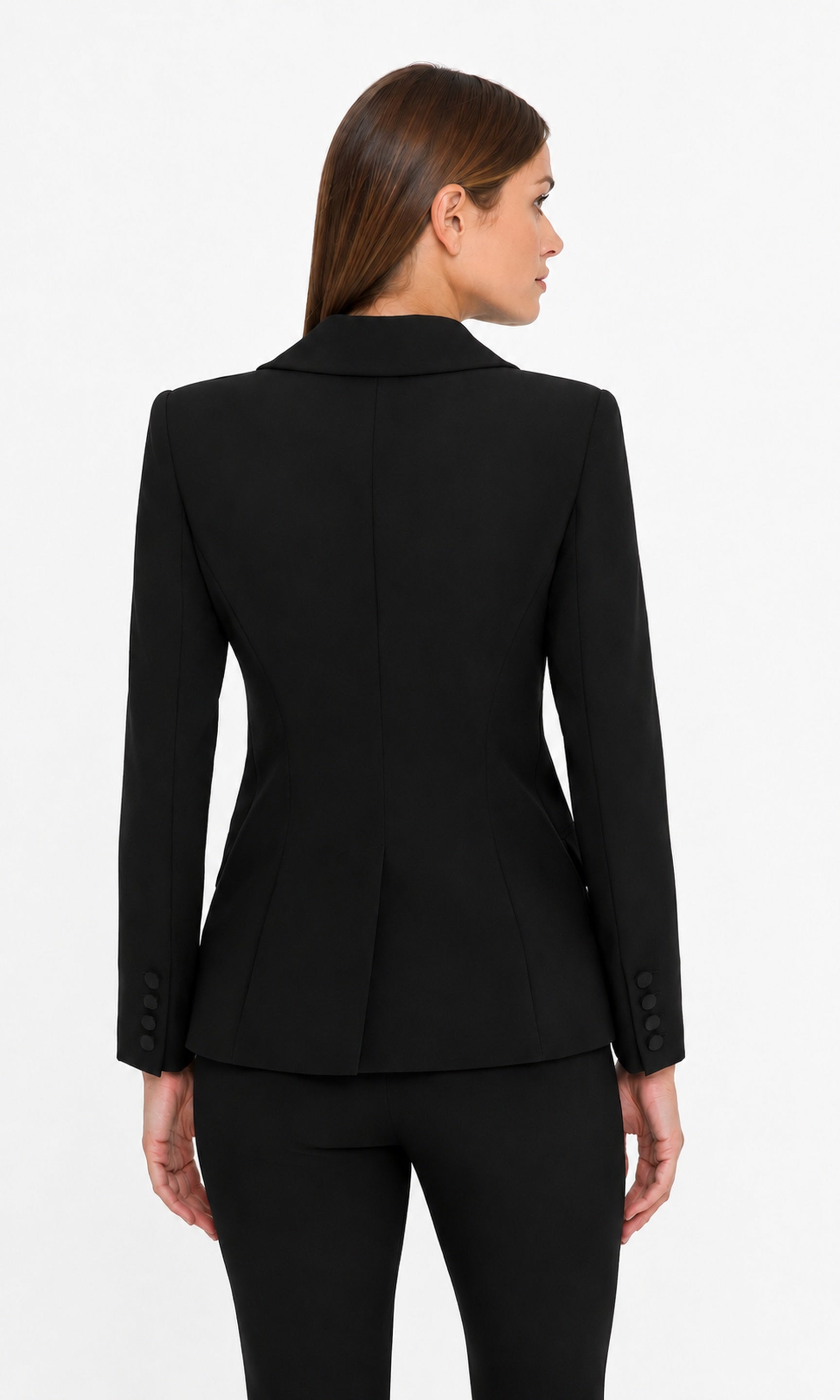 Woman wearing a black suit jacket on a white background