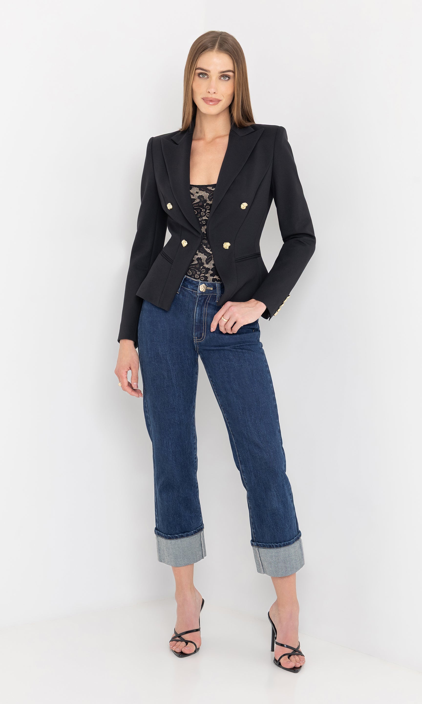 Full body front view of the model in the wallis ponte blazer styled with jeans.
