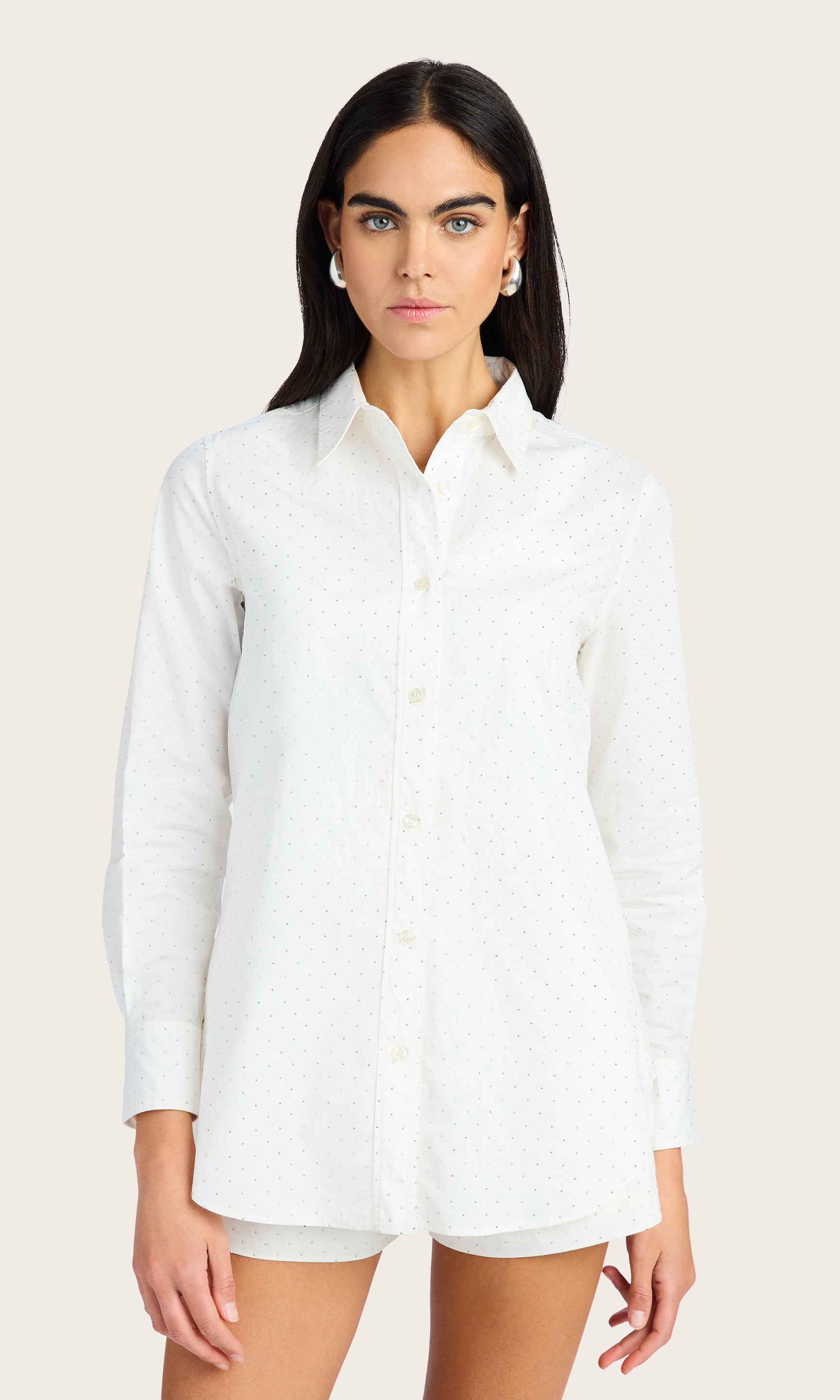 Front view of the model wearing the Marc Crystal Shirt in white, styled as a shirt dress with rolled-up sleeves and no visible bottom