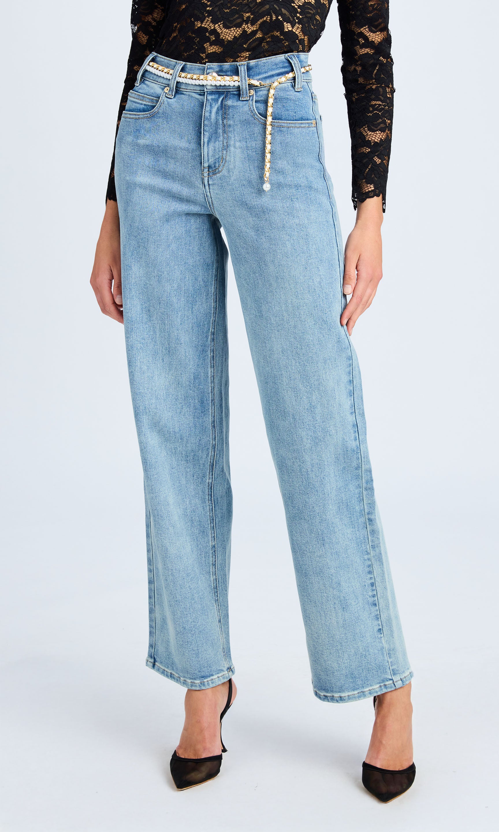 A pair of wide leg denim jeans featuring a stylish belt, showcasing a relaxed and trendy fit