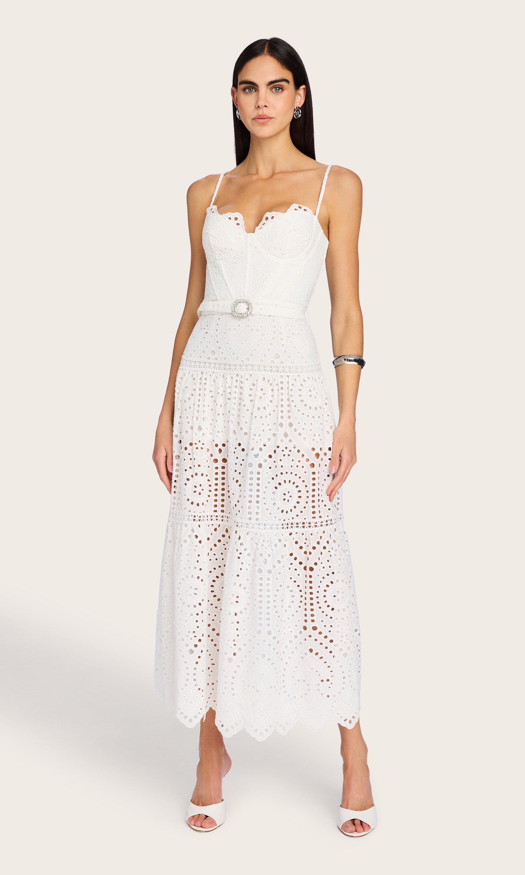 Full body view showing the belted waist and tiered semi-sheer silhouette from head to toe