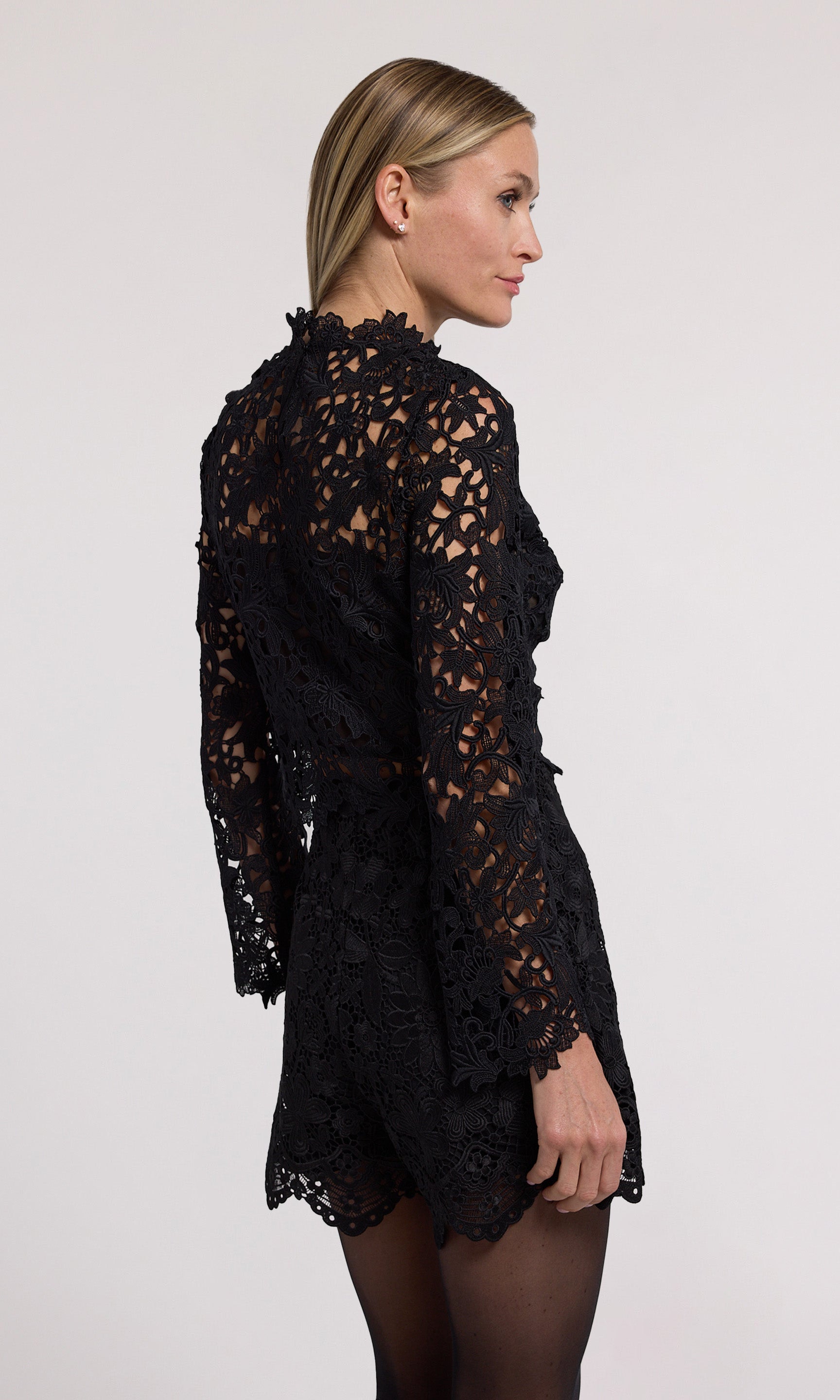 Minda Guipure Lace Top has a stylish high neckline and long sleeves, made from beautiful black lace fabric.