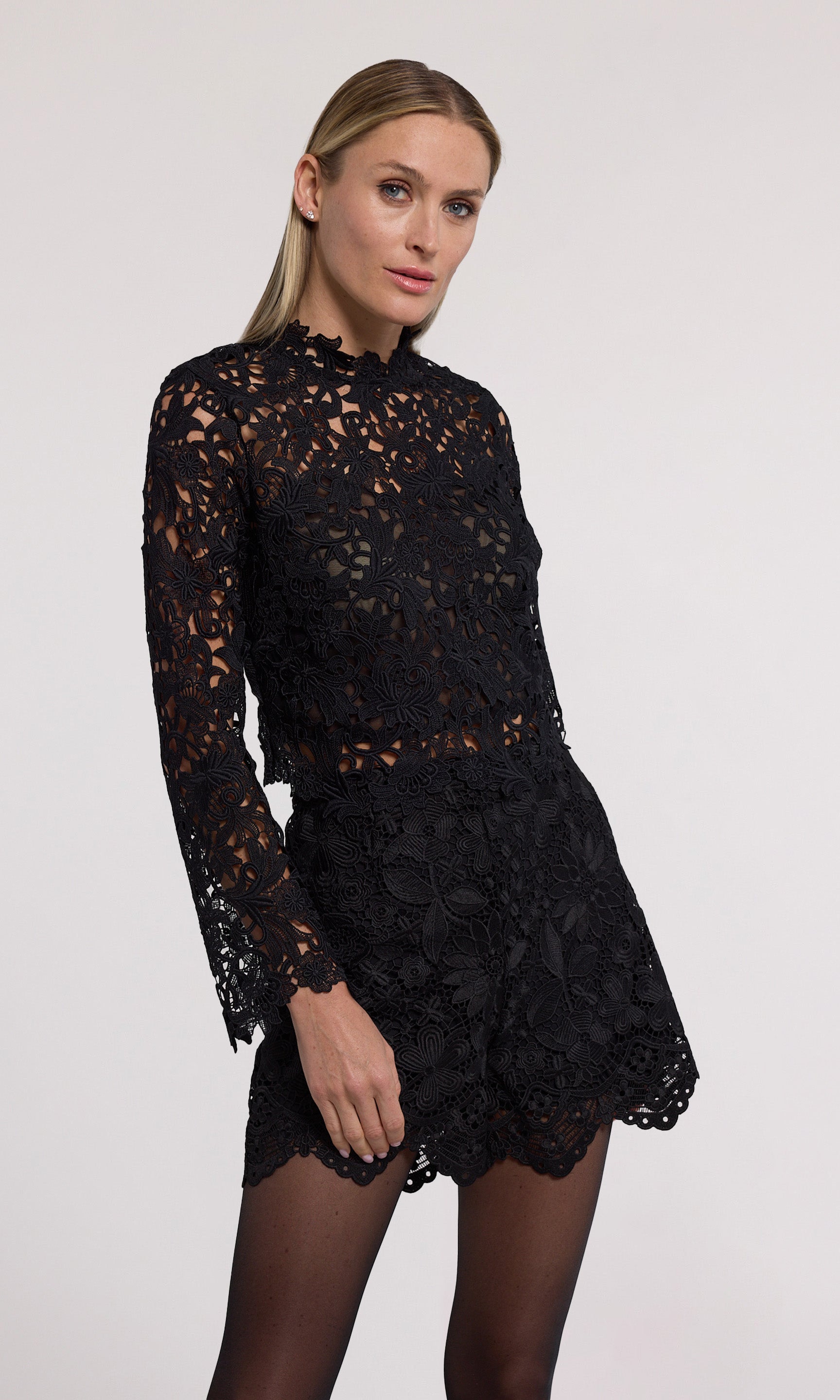 Minda Guipure Lace Top has a stylish high neckline and long sleeves, made from beautiful black lace fabric.