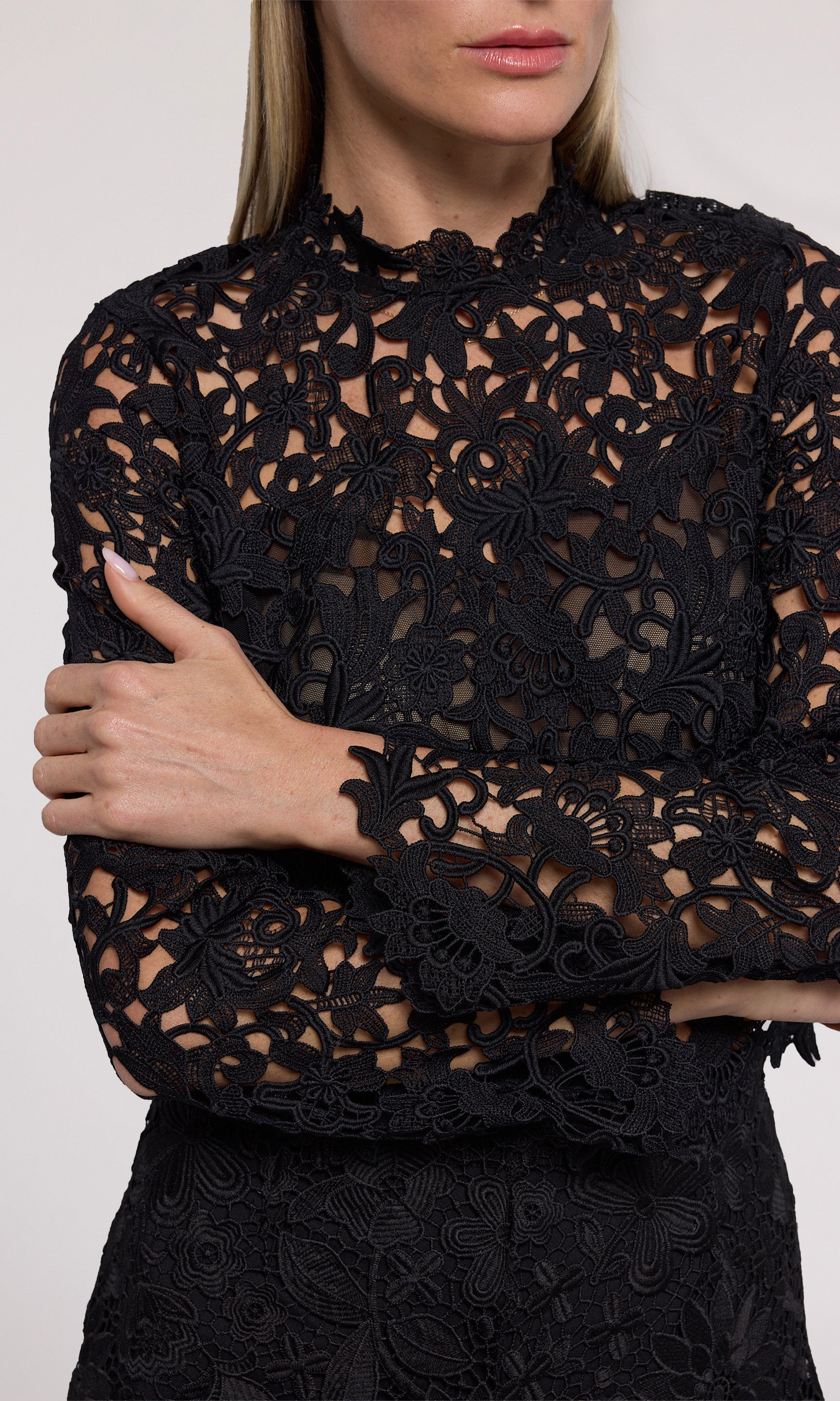 Minda Guipure Lace Top has a stylish high neckline and long sleeves, made from beautiful black lace fabric.