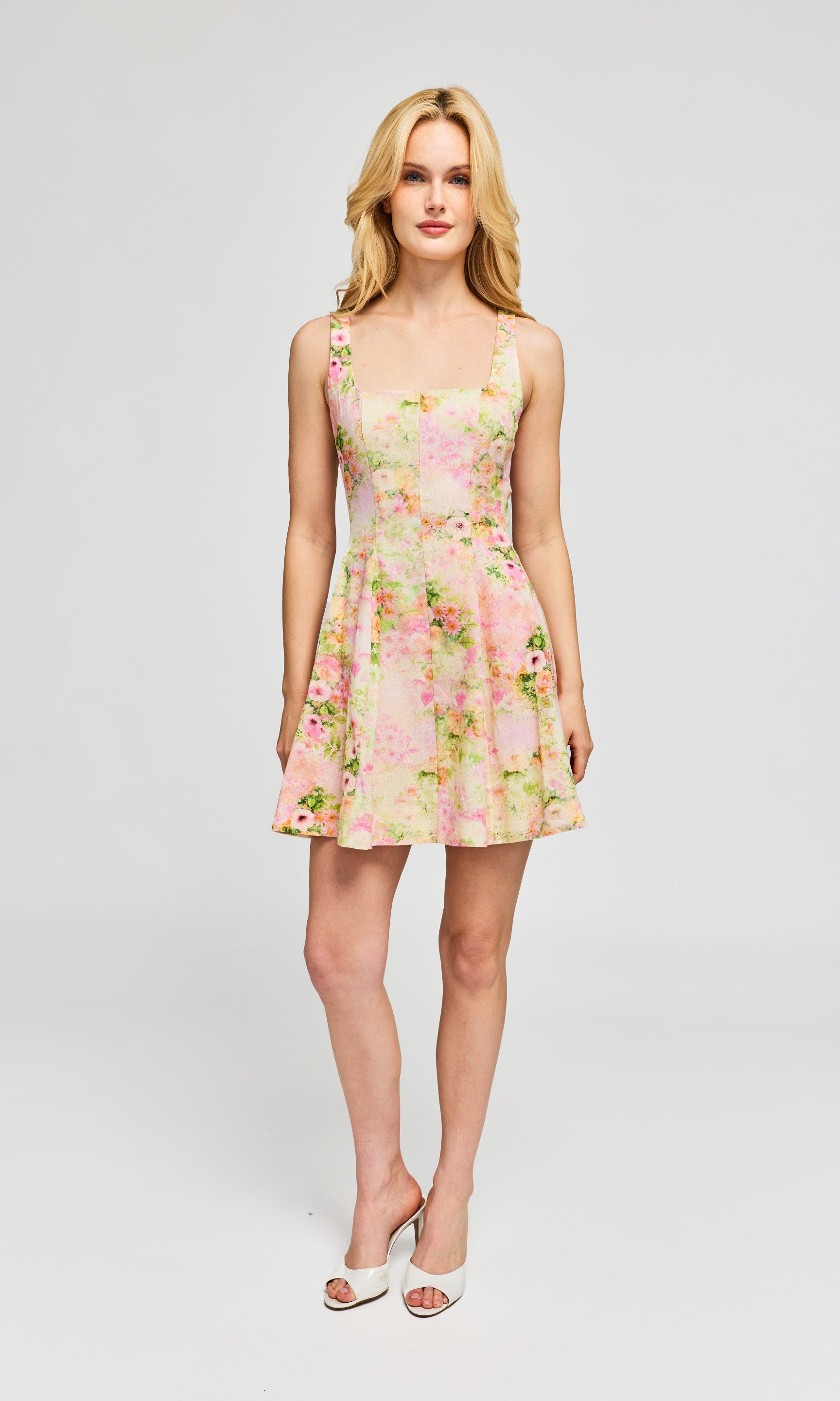 Woman wearing a floral dress on a white background