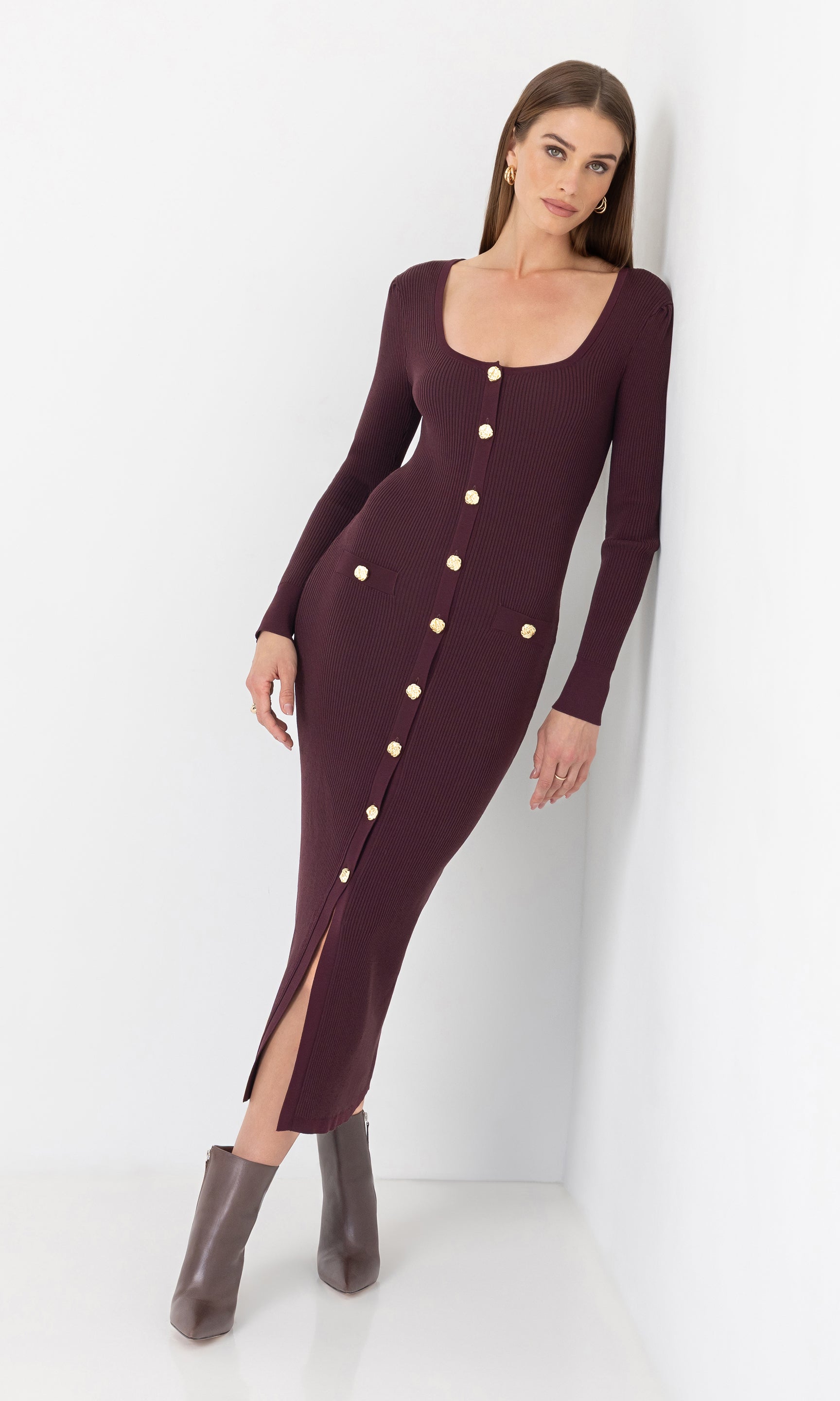 Front view of the model wearing the andolina square neck dress with gold button details.