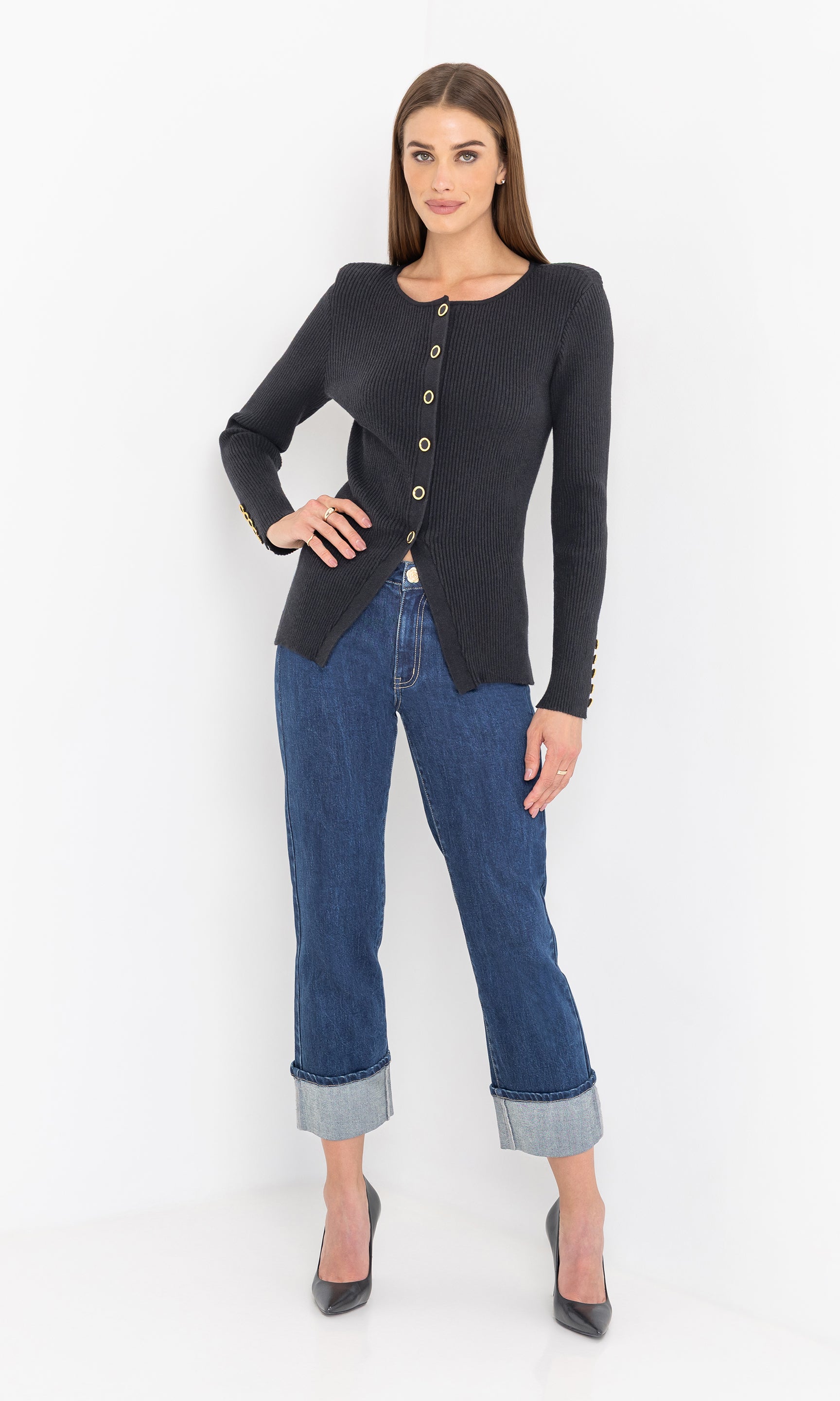 Full body front view of the model in the cherish rib cardigan styled with jeans.