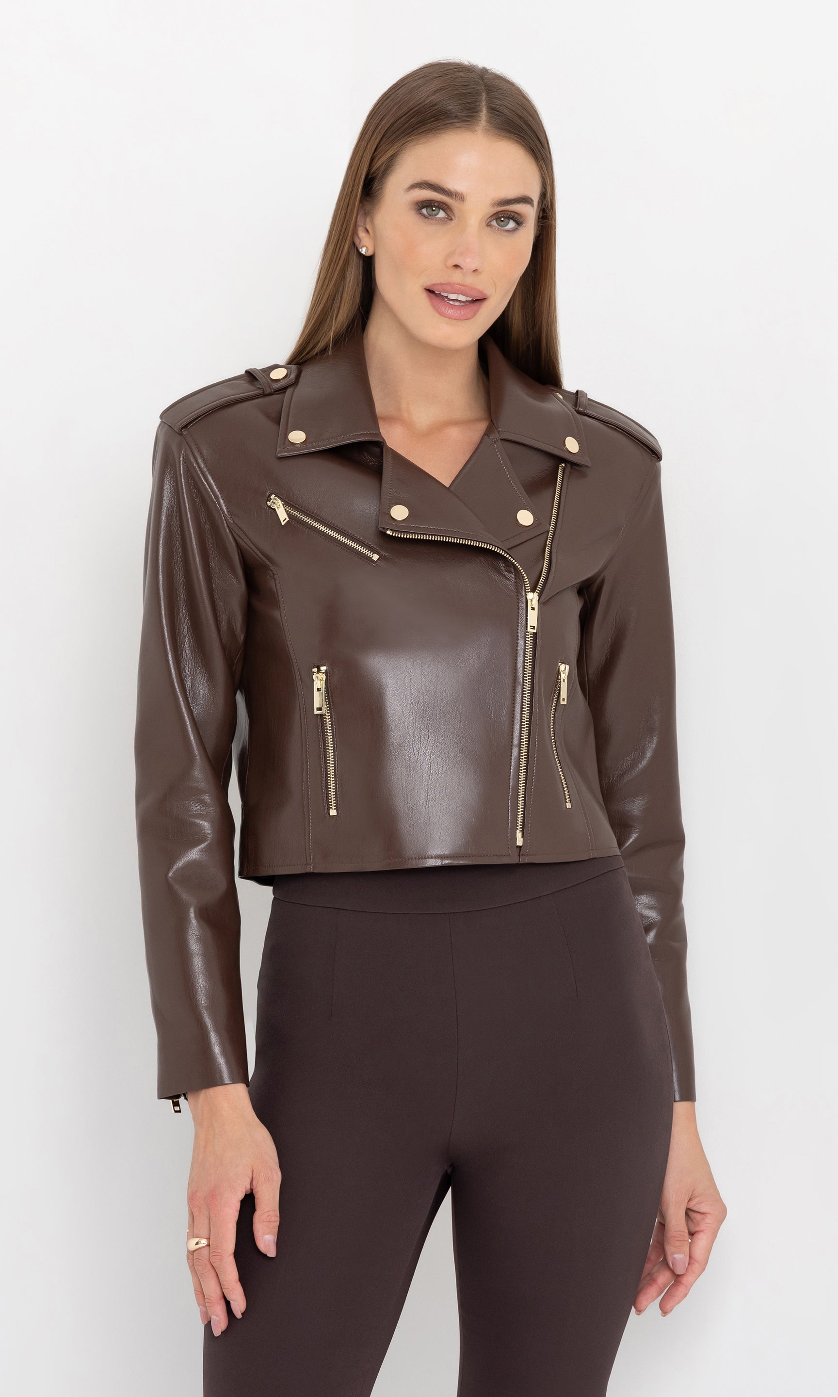 Front view of the cosita vegan leather jacket styled with slim pants.