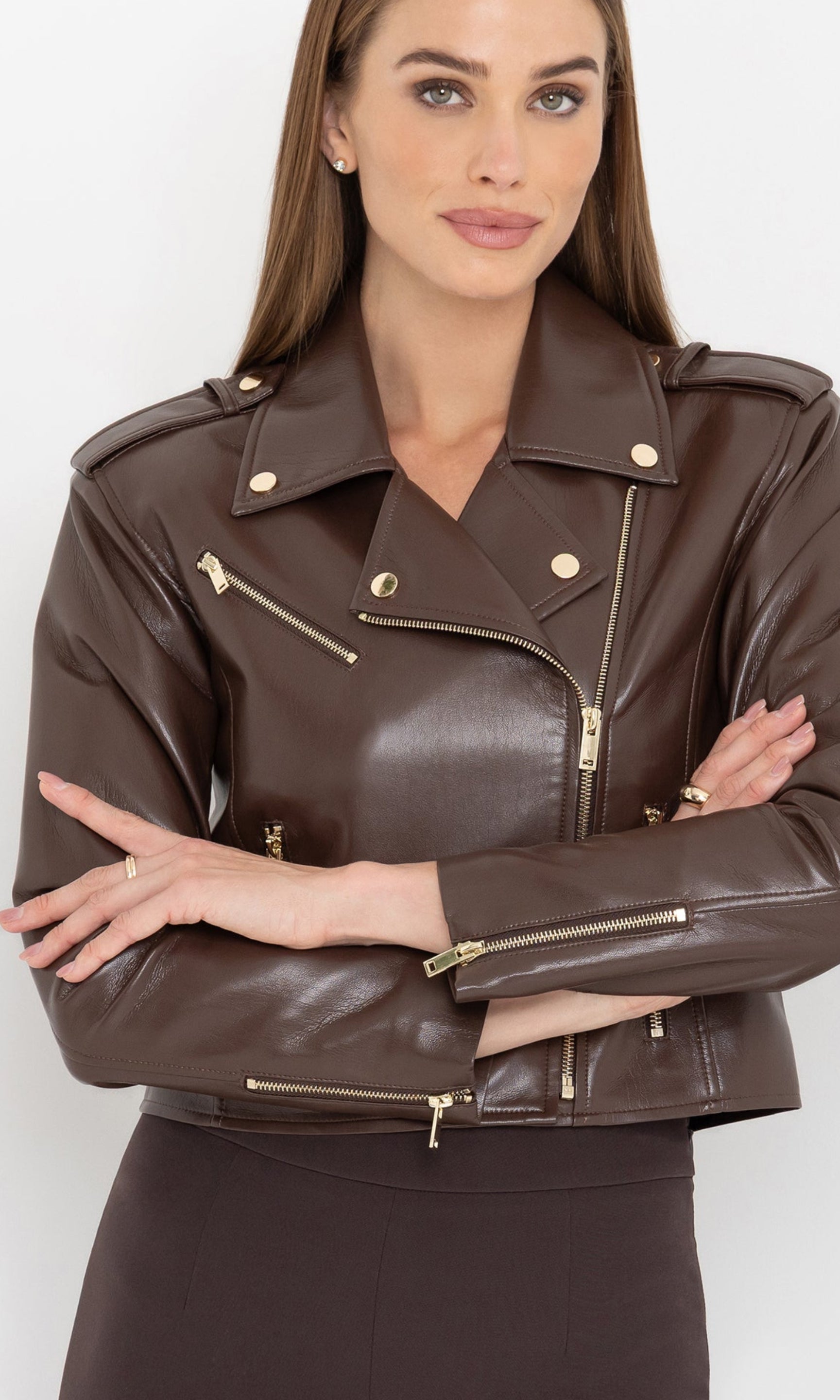 Close-up front view of the cosita vegan leather jacket with arms crossed.