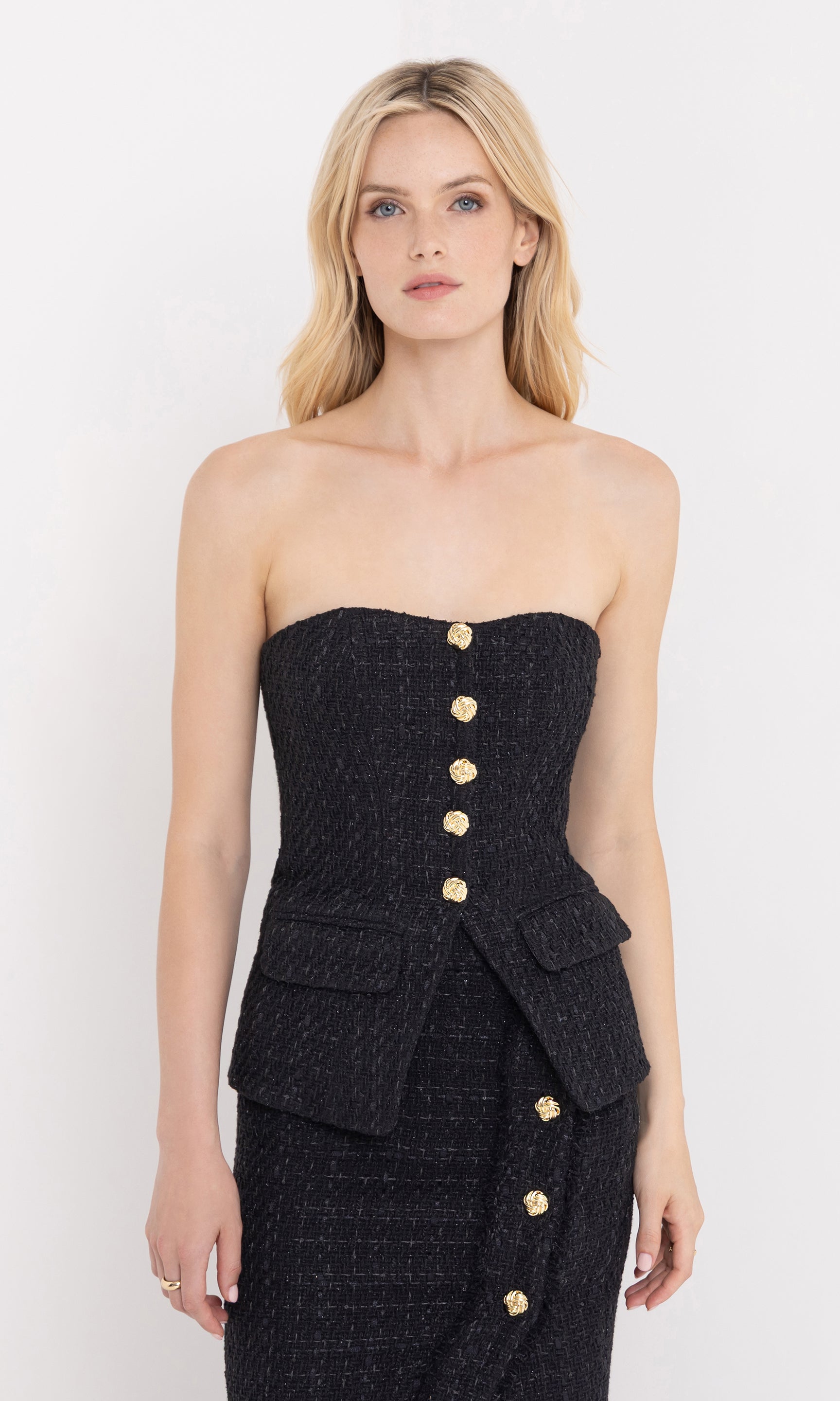 Three-quarter front view of the quinn tweed vestier showing the tailored silhouette.