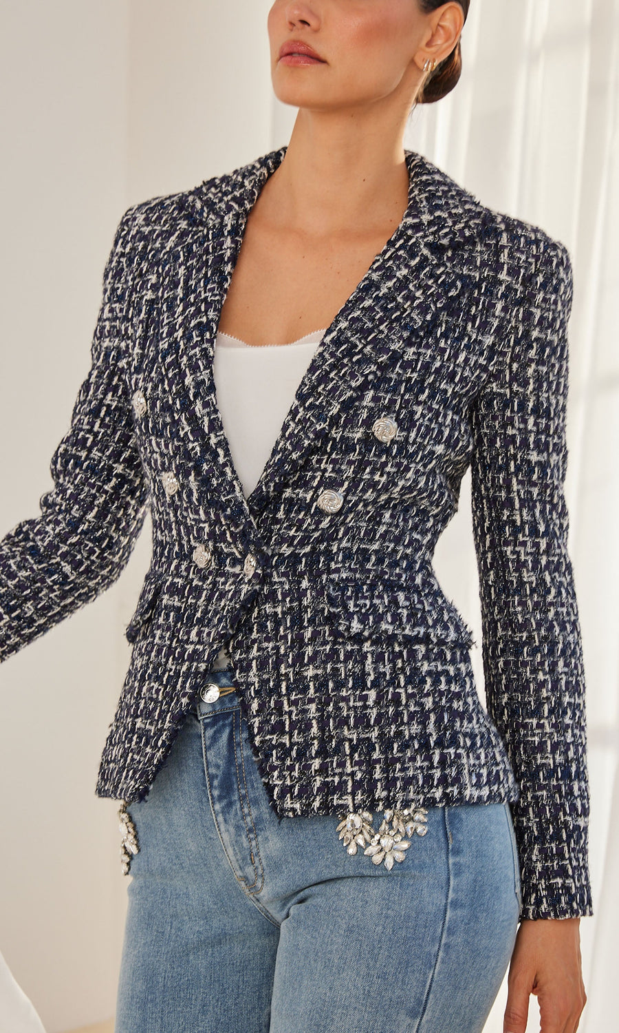 Back view of the blazer highlighting the tailored fit and tweed details