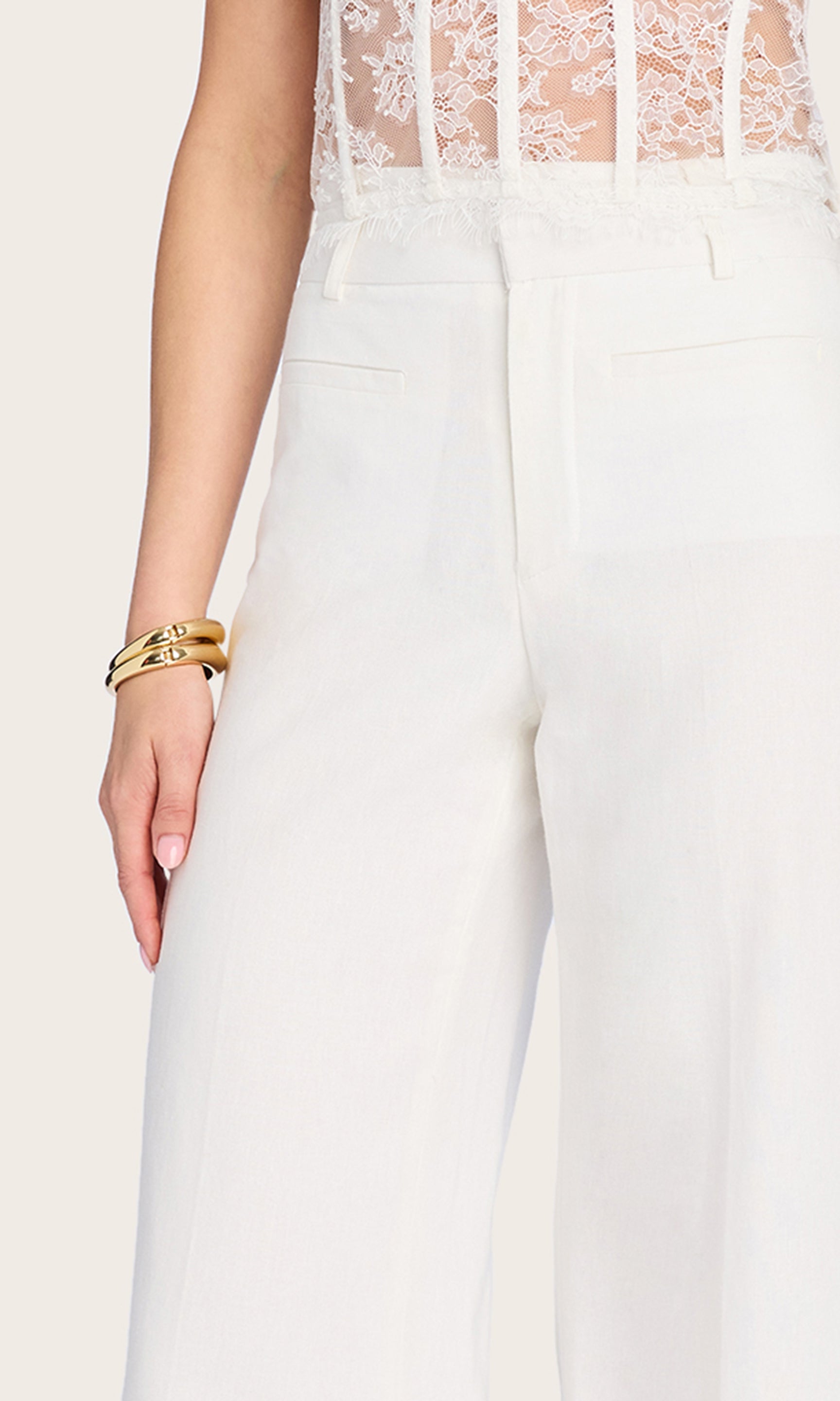 Close-up detail of the Raquel Linen Pants highlighting the crisp tailoring, functional pockets, and clean waistband construction.